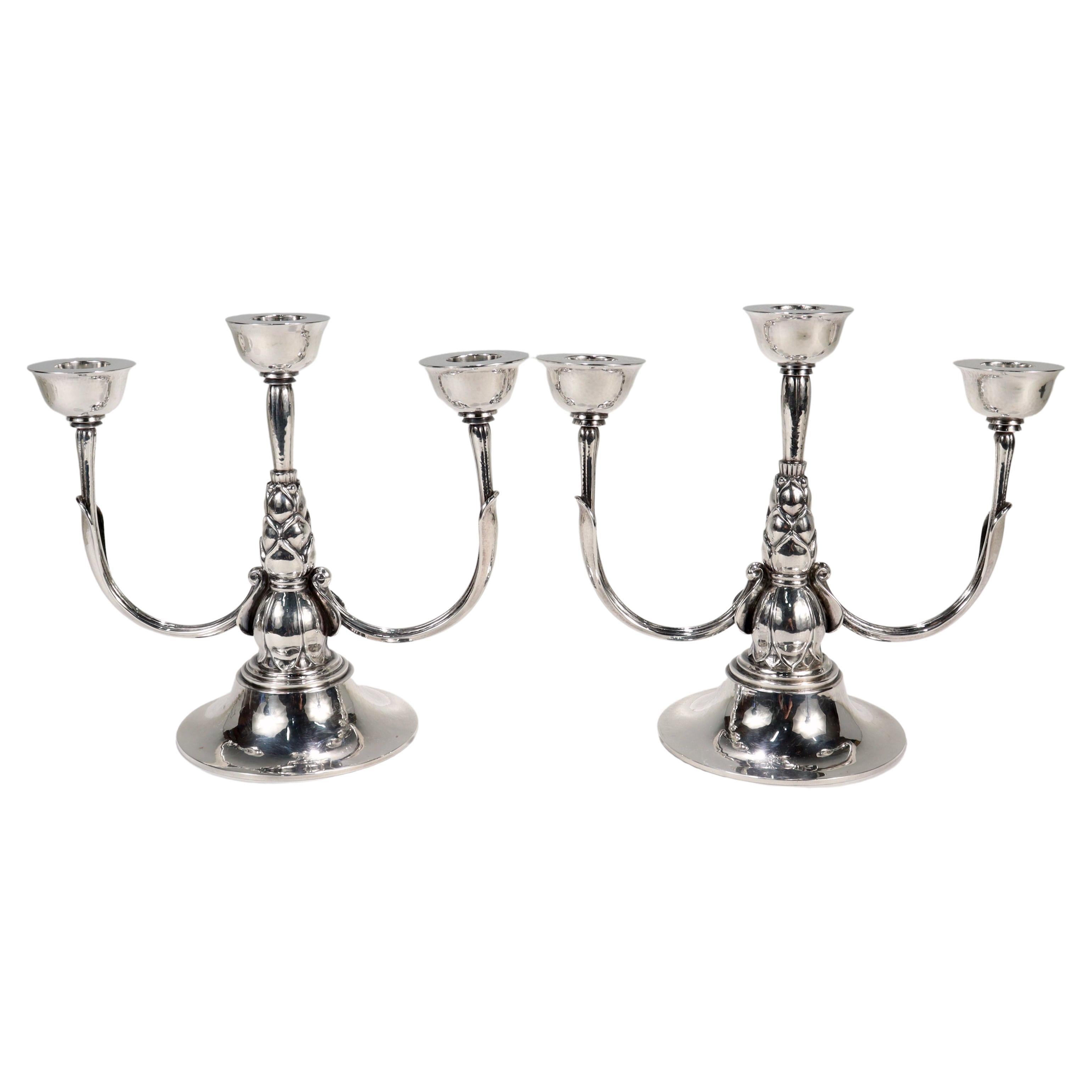 A fine pair of sterling silver candelabra.

By Georg Jensen.

In sterling silver. 

Model No. 537 C. 

Designed by Harald Nielsen. 

Simply a stunning pair of Jensen candelabra! 

Date:
20th Century

Overall Condition:
It is in overall good,