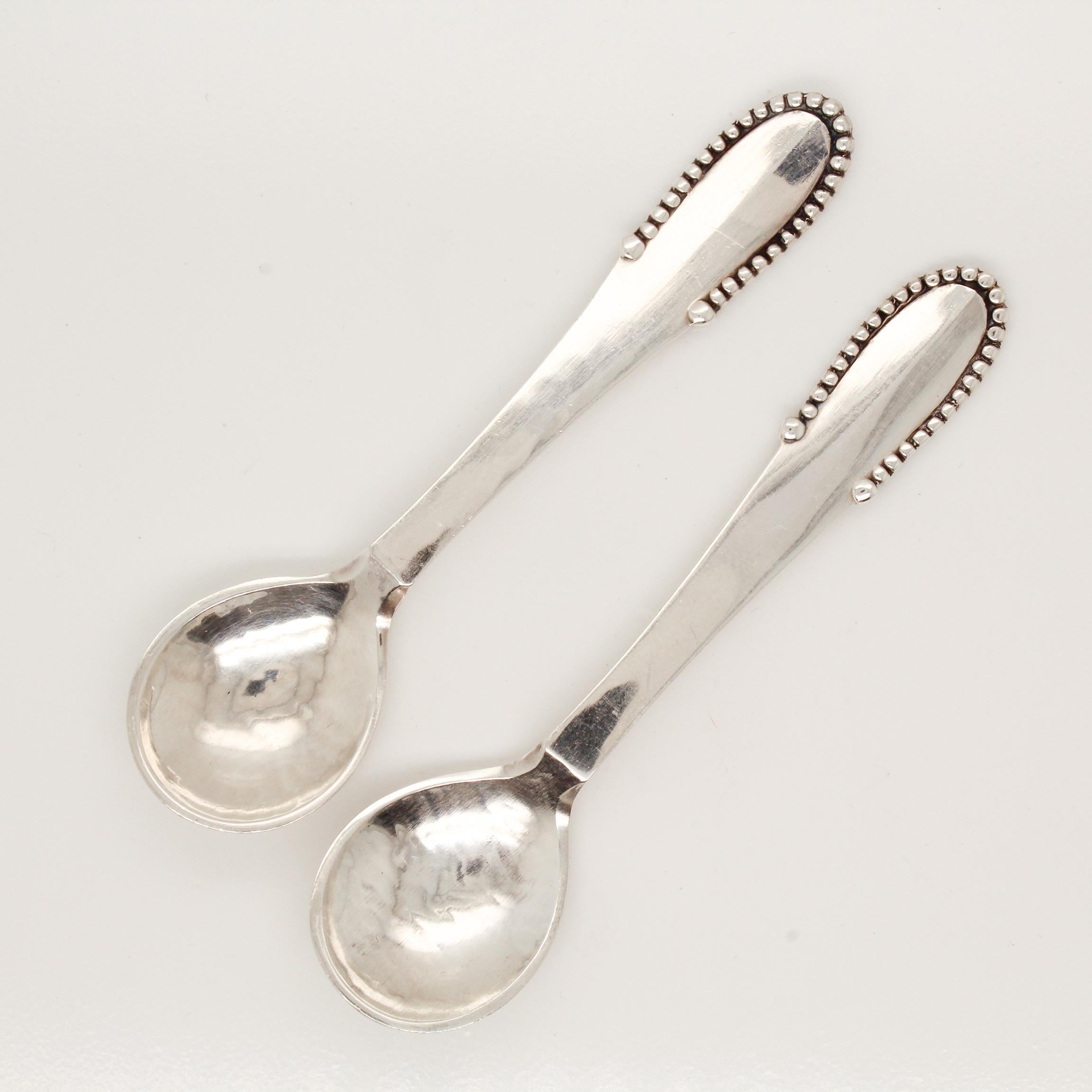 A pair of fine Georg Jensen sterling silver salt spoons.

In the Beaded pattern.

Designed by Georg Jensen.

Simply a wonderful pair of Jensen salt spoons!

Date:
20th Century

Overall Condition:
They are in overall good, as-pictured, used estate