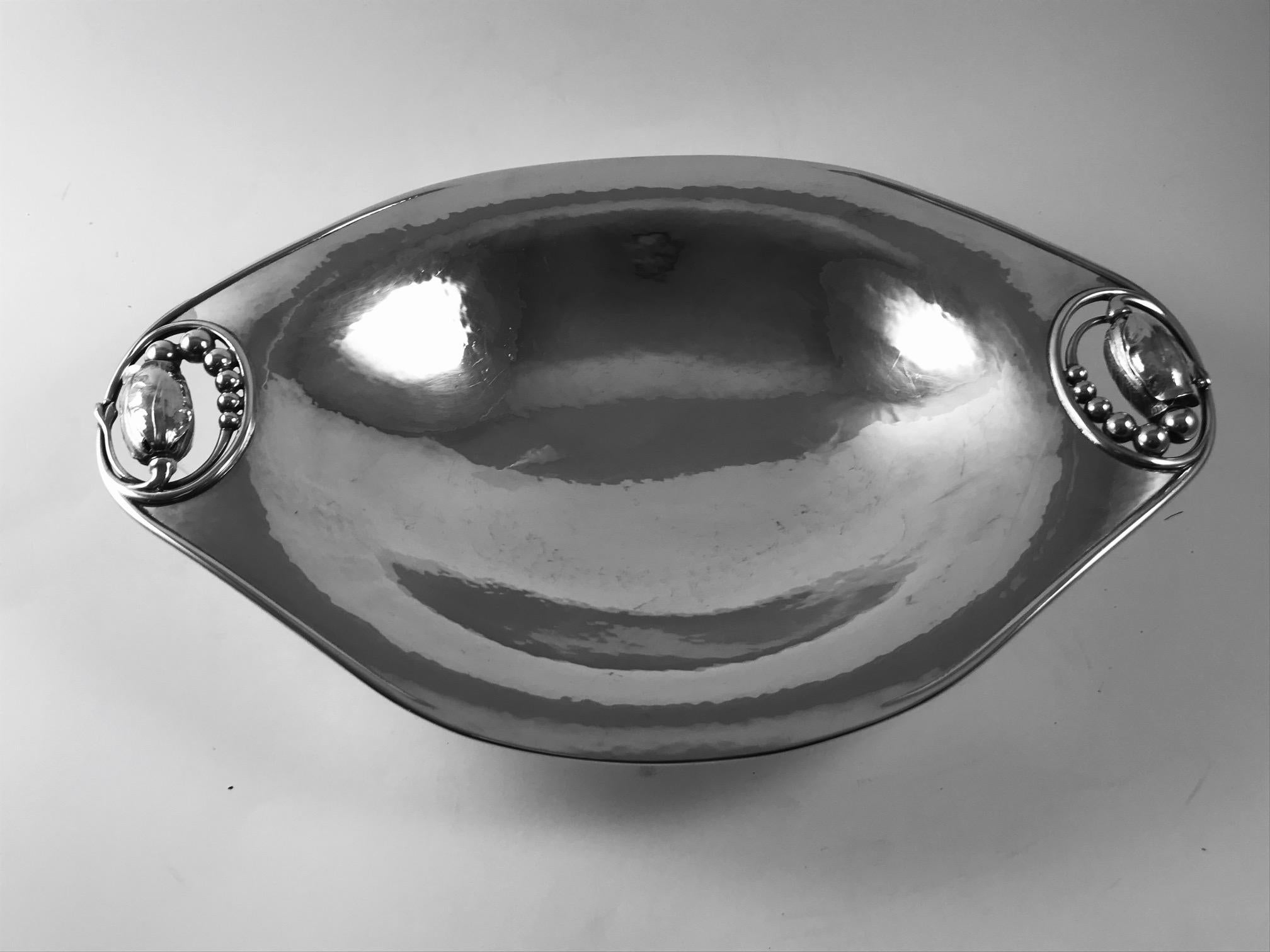 A pair of sought-after Georg Jensen Blossom oval footed bread trays, design #2A by Georg Jensen.
Each measures 12? in length x 7 3/4