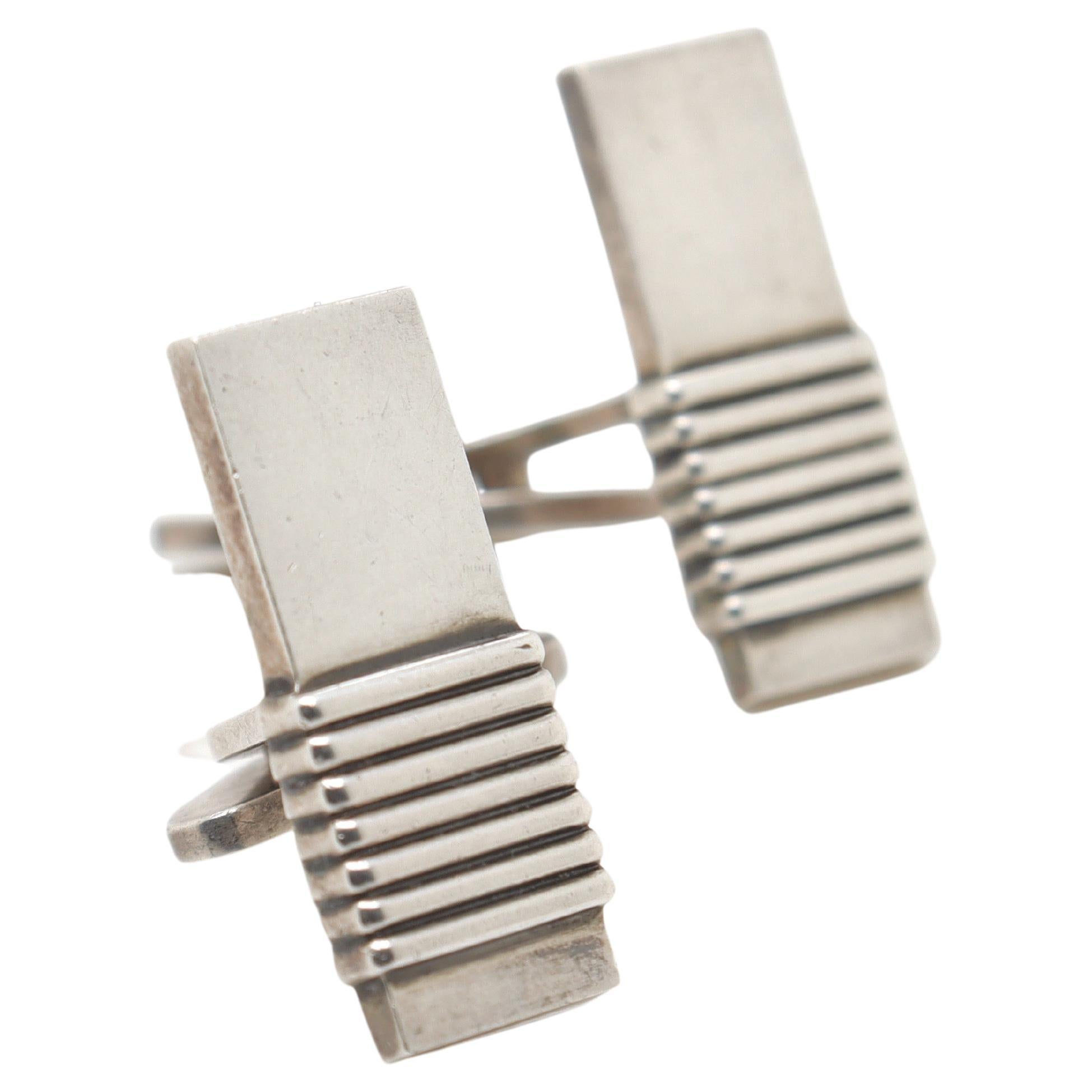 A fine pair of Georg Jensen sterling silver cufflinks

Model no. 80.

Designed by Harold Nielsen for Georg Jensen

Simply a wonderful pair of cufflinks from one of Denmark's premier silversmiths!

Date:
20th Century, post-1945

Overall