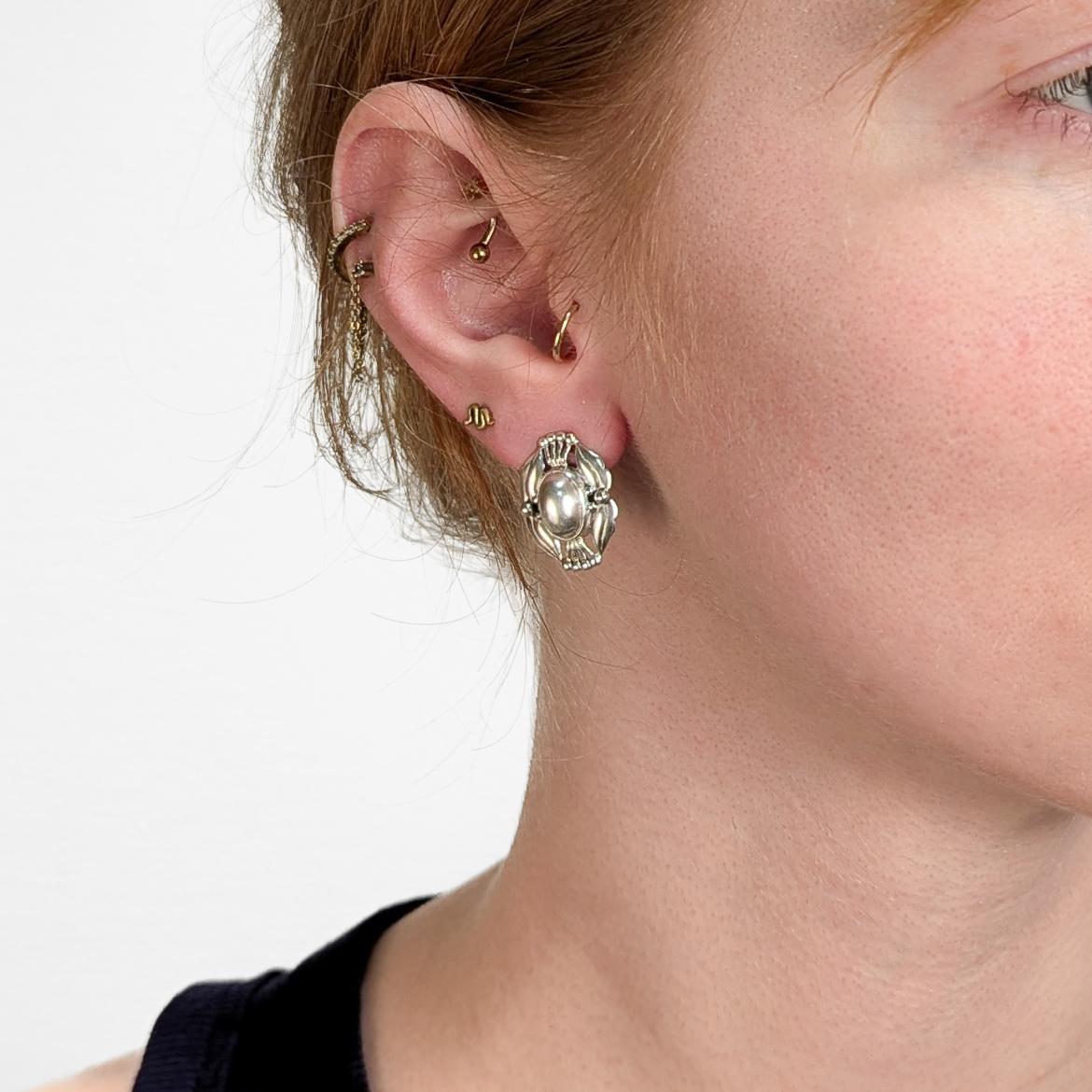 A fine pair of signed Georg Jensen earrings.

In sterling silver.

From the Heritage Collection series.

Produced in 2000.

Each with clip-on closures.

Fully marked to the reverse of each.

Simply a wonderful pair of Jensen Heritage