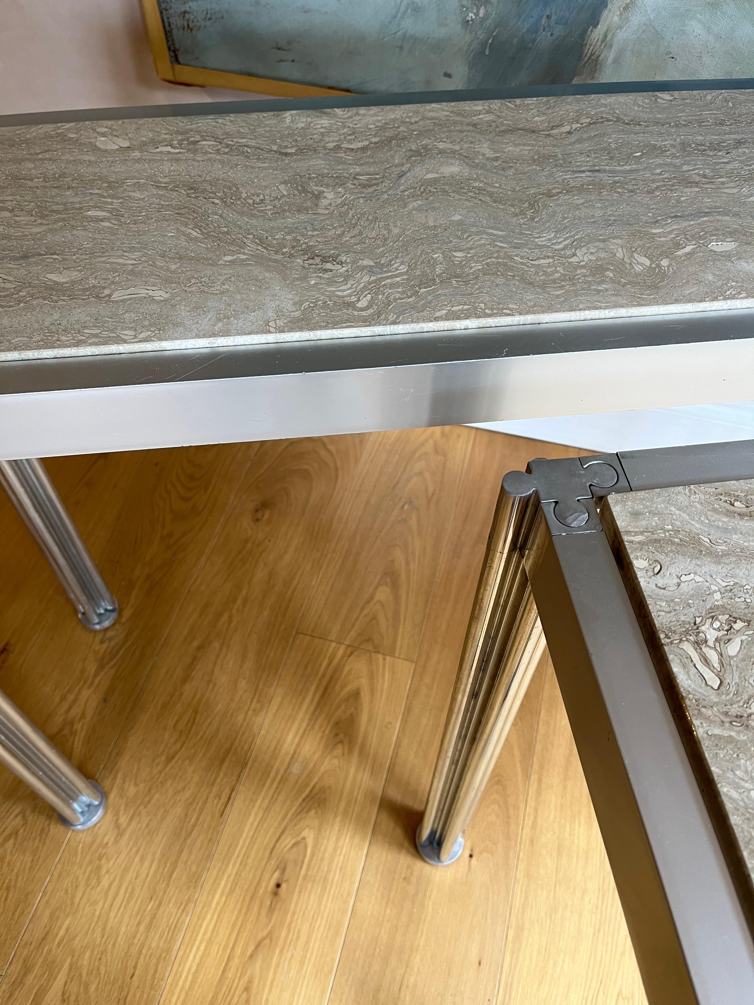 Late 20th Century Pair of George Cianciamino brushed aluminium and travertine console tables