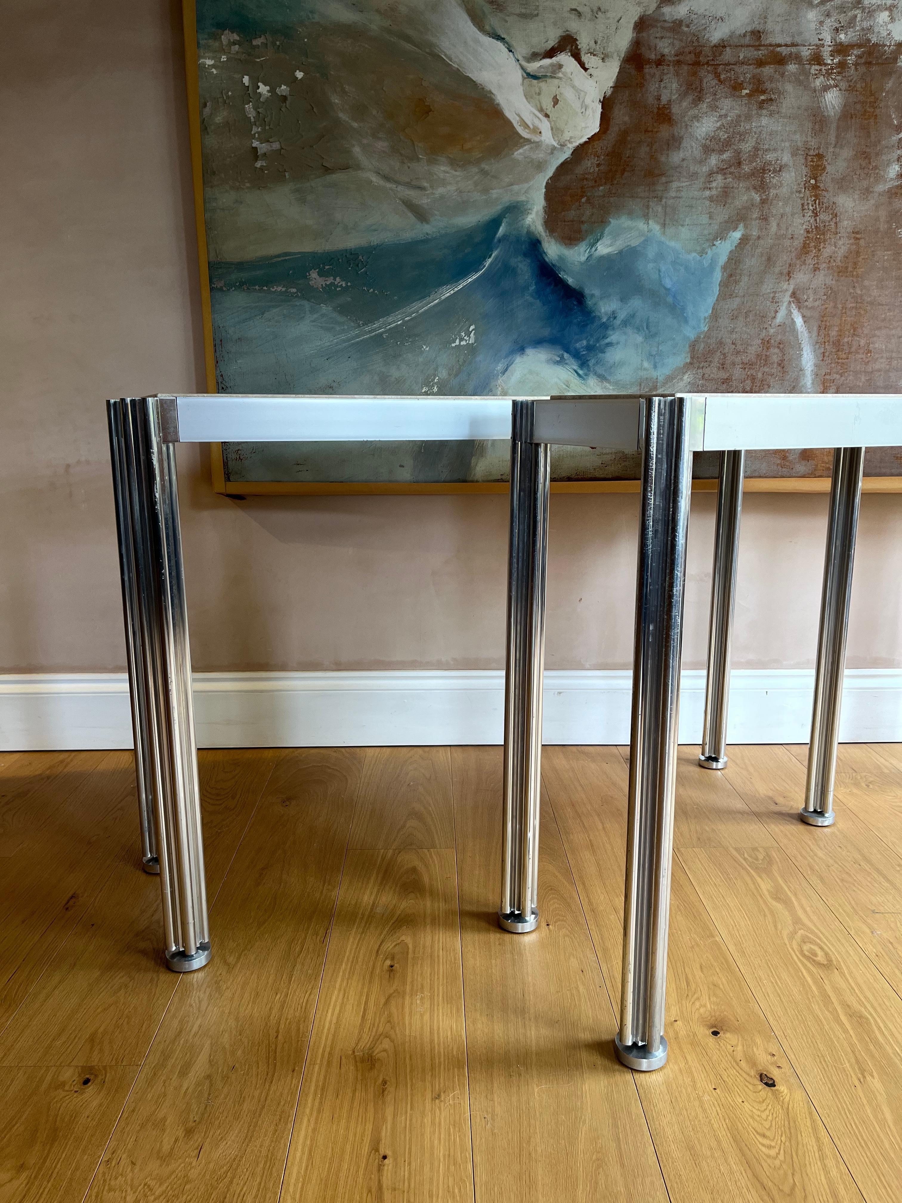 Aluminum Pair of George Cianciamino brushed aluminium and travertine console tables