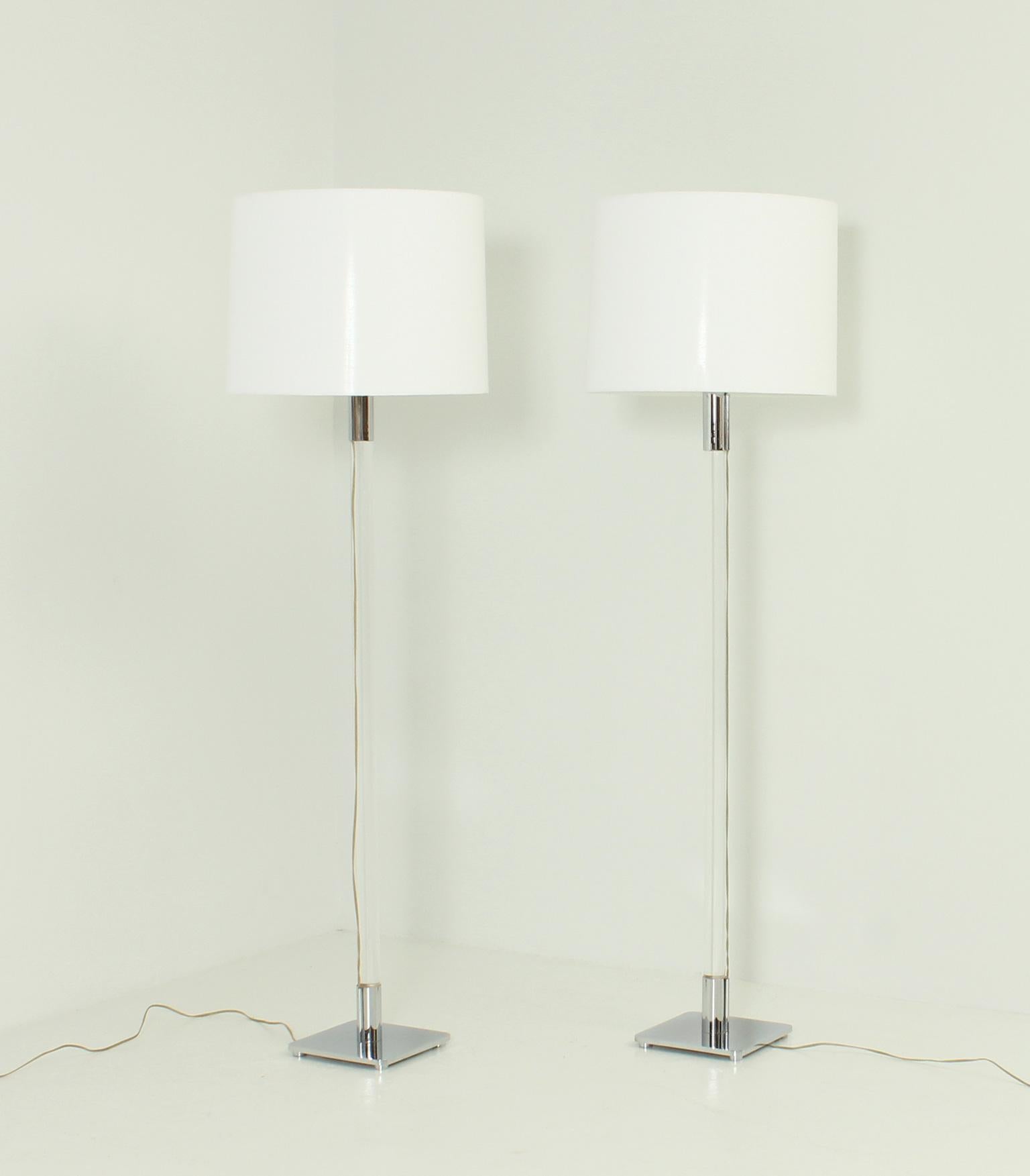 Pair of Hansen floor lamps designed in 1970's by George Hansen for Metalarte, Spain. Chromed-plated brass and plexiglass column, multiple rotary switch beneath diffuser assembly for 1, 2 or 3 bulbs. Original shades with new fabric.