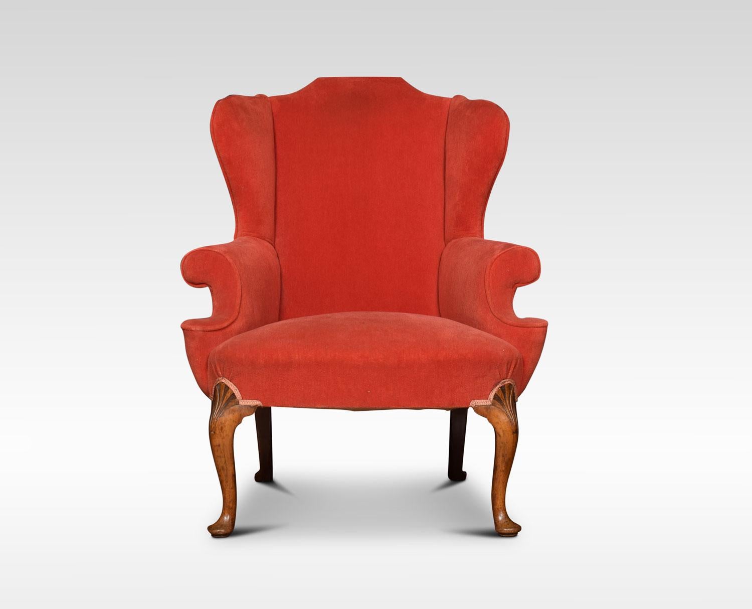 Pair of George I style wing armchairs upholstered in red fabric, raised up on shell carved cabriole front legs, terminating in pad feet.
Dimensions:
Height 42 inches, height to seat 18 inches
Width 32 inches
Depth 32.5 inches.