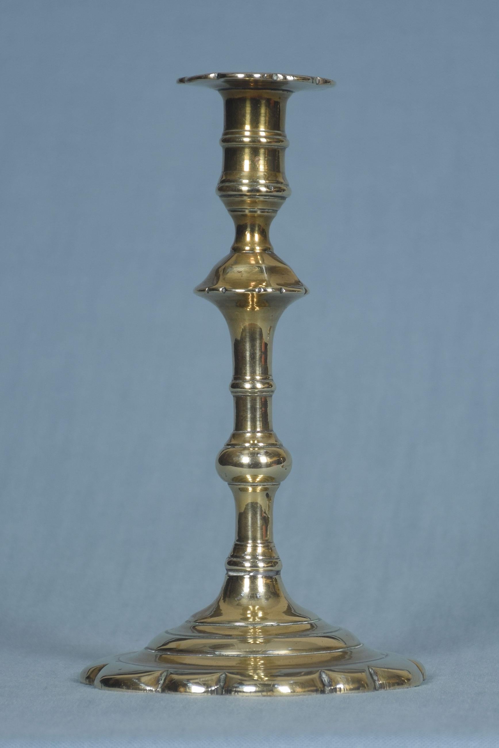Pair of George II brass candlesticks each with a knopped stem and a petal base.
Dimensions
Height 8 inches
Length 4.5 inches
Depth 4.5 inches.