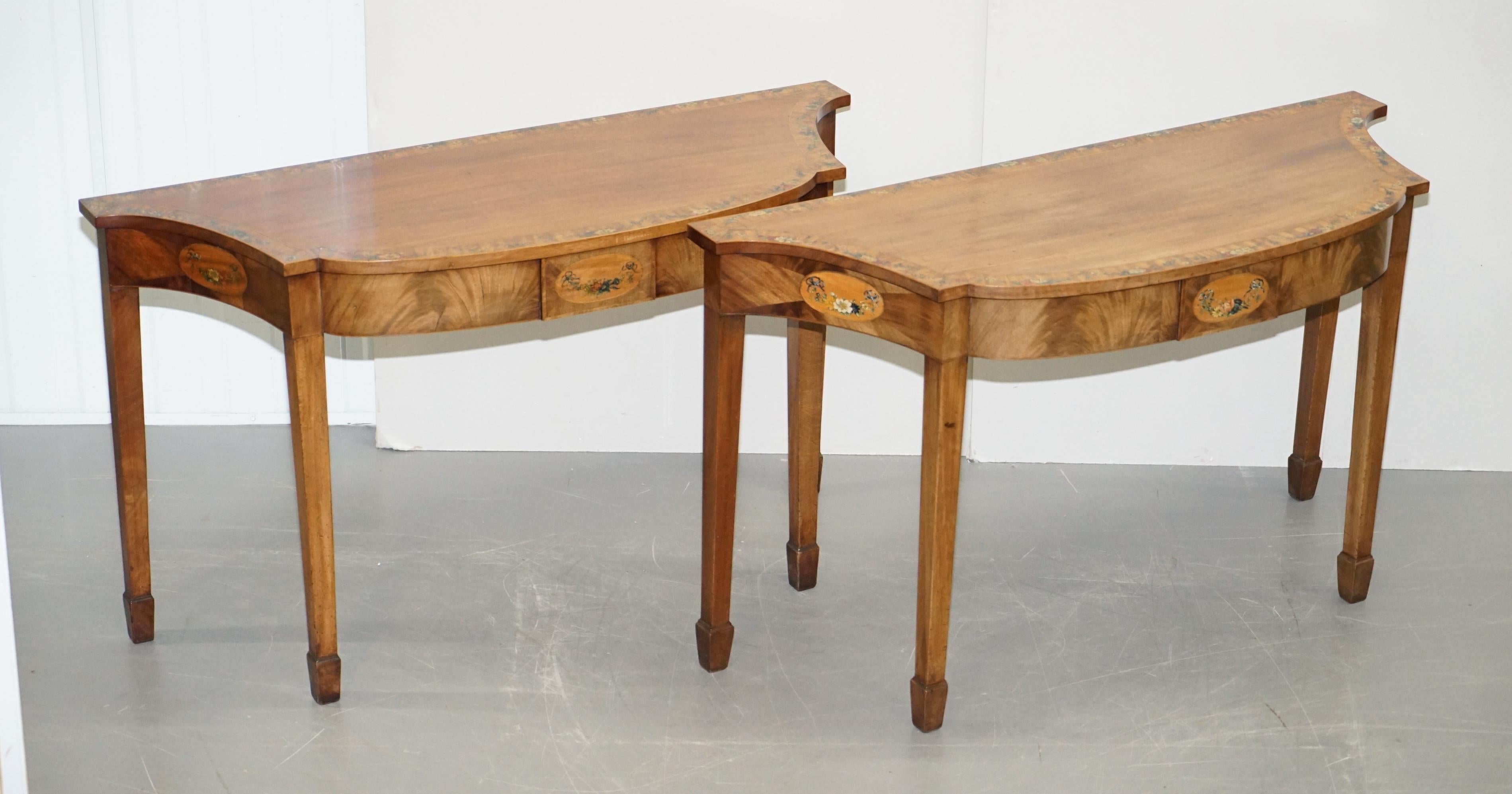 We care delighted to offer for sale this very fine pair of satinwood and tulipwood polychrome painted George III serpentine console tables

An exquisite pair of fine English circa 1780-1790 console tables. These are highly decorative pieces, its