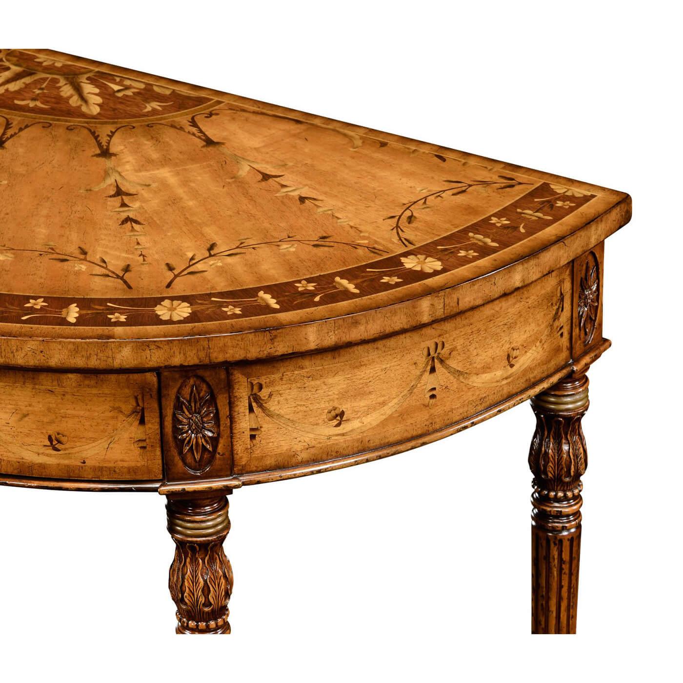 George III Adam style satinwood and walnut demilune console with fine marquetry inlay of swags and leaves, one drawer with oak secondary wood, matching swag handles, and carved paterae to the top of the tapering fluted legs. After a design of circa