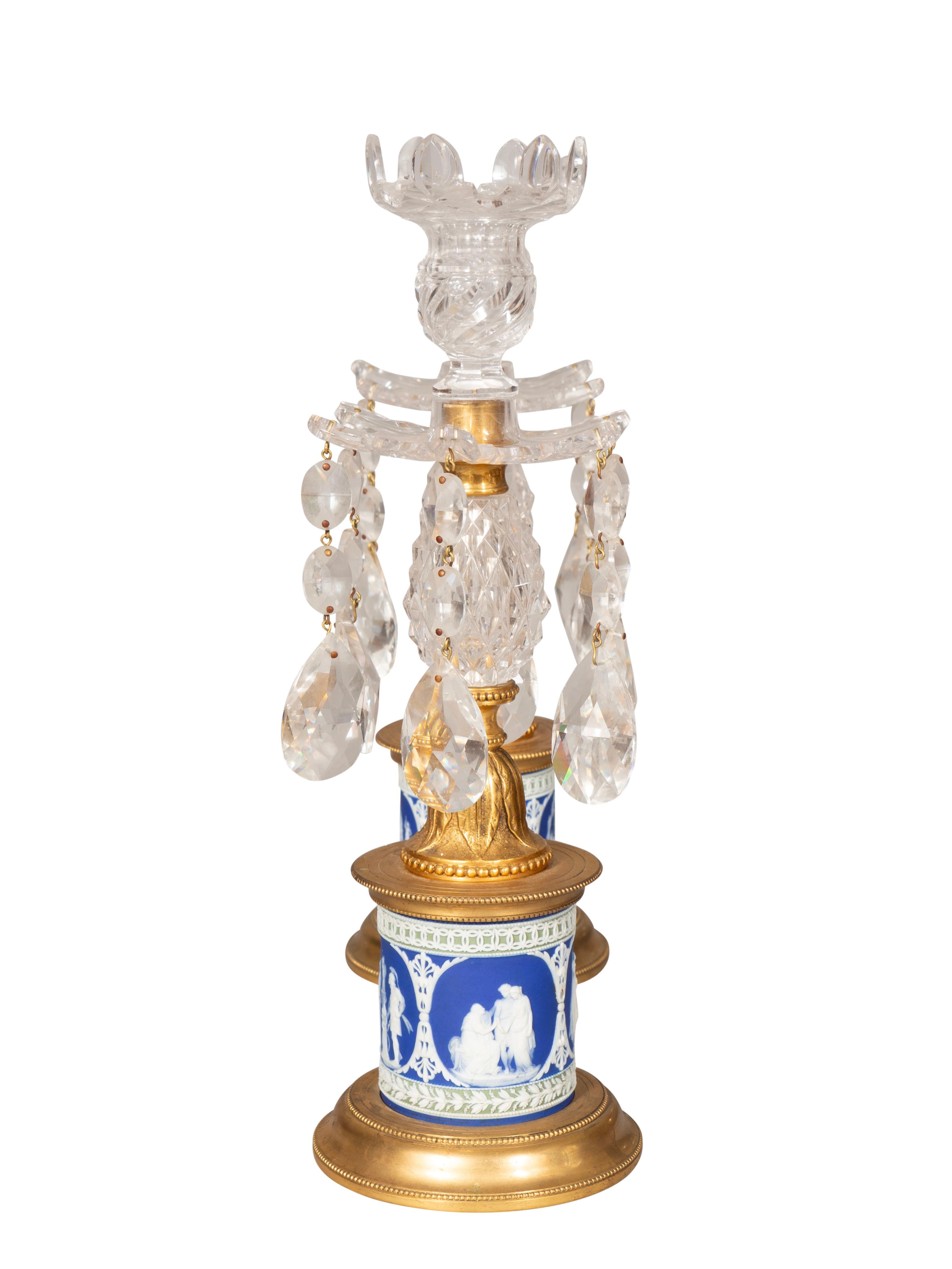 Each single candle holder and bobeche with suspended drops. Cut crystal stem and blue and white jasper plinth base.