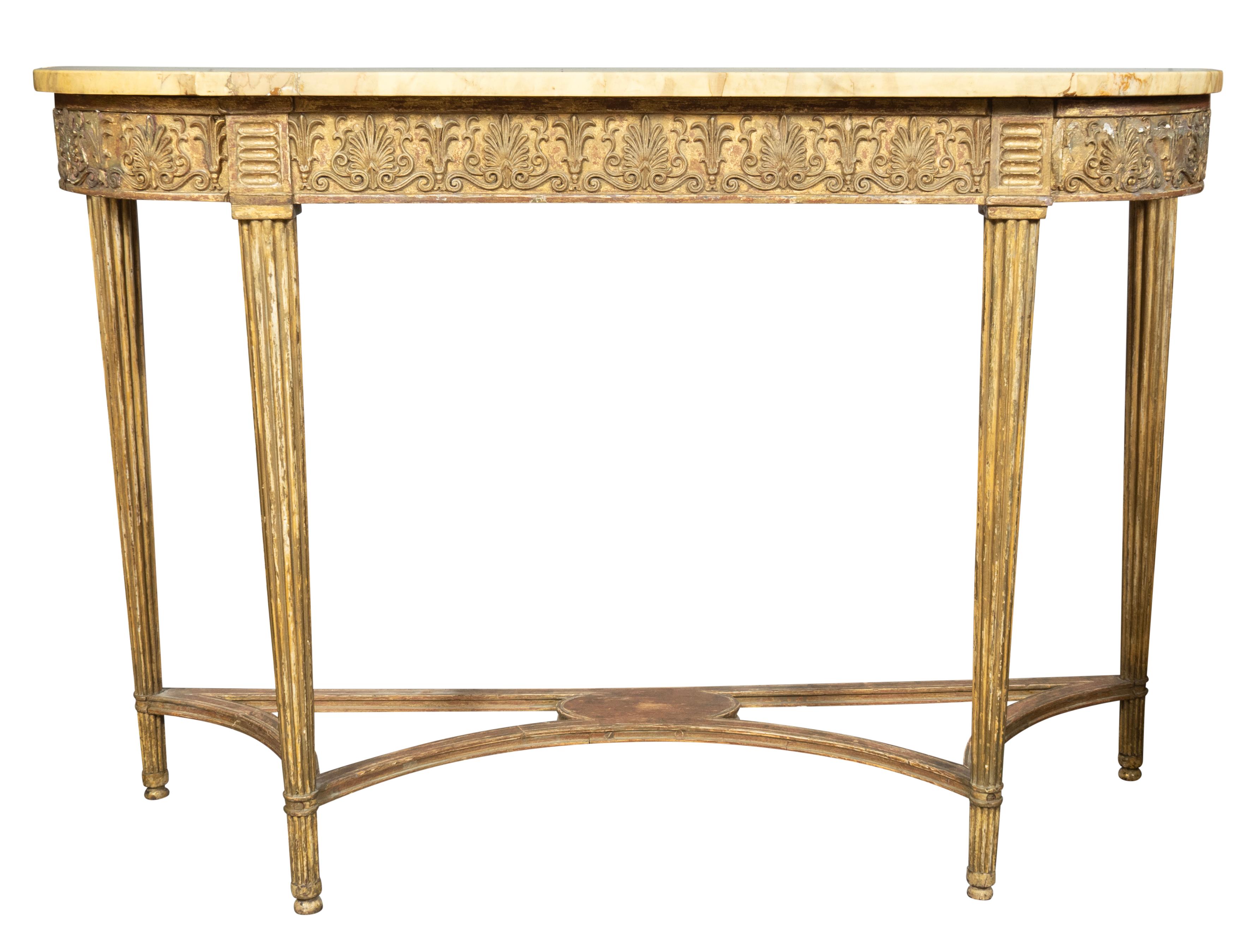 Each with a rectangular top and rounded ends. The marble a light Siena color. The base a worn original gilding slightly distressed. Decorated with anthemion and palmettes. Circular tapered fluted legs joined by a stretcher.