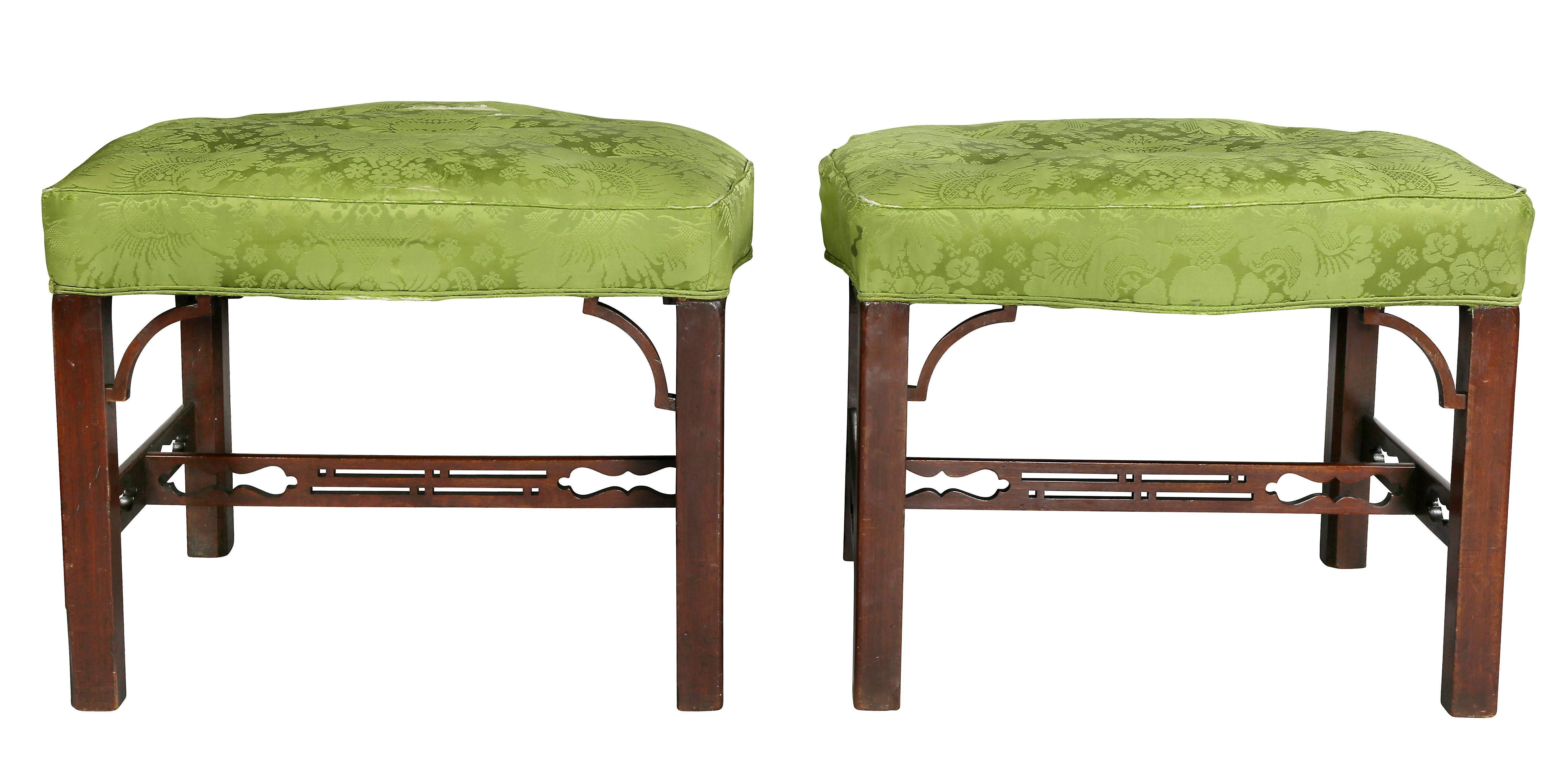 Each with upholstered seats and square legs with bracket corners and joined by pierced stretchers.