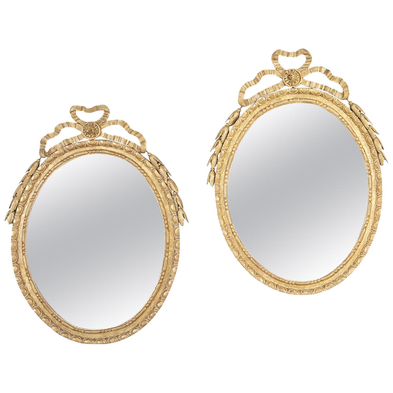 Pair of George III Oval Giltwood Mirrors