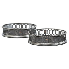 Pair of George III pierced sterling silver wine coasters