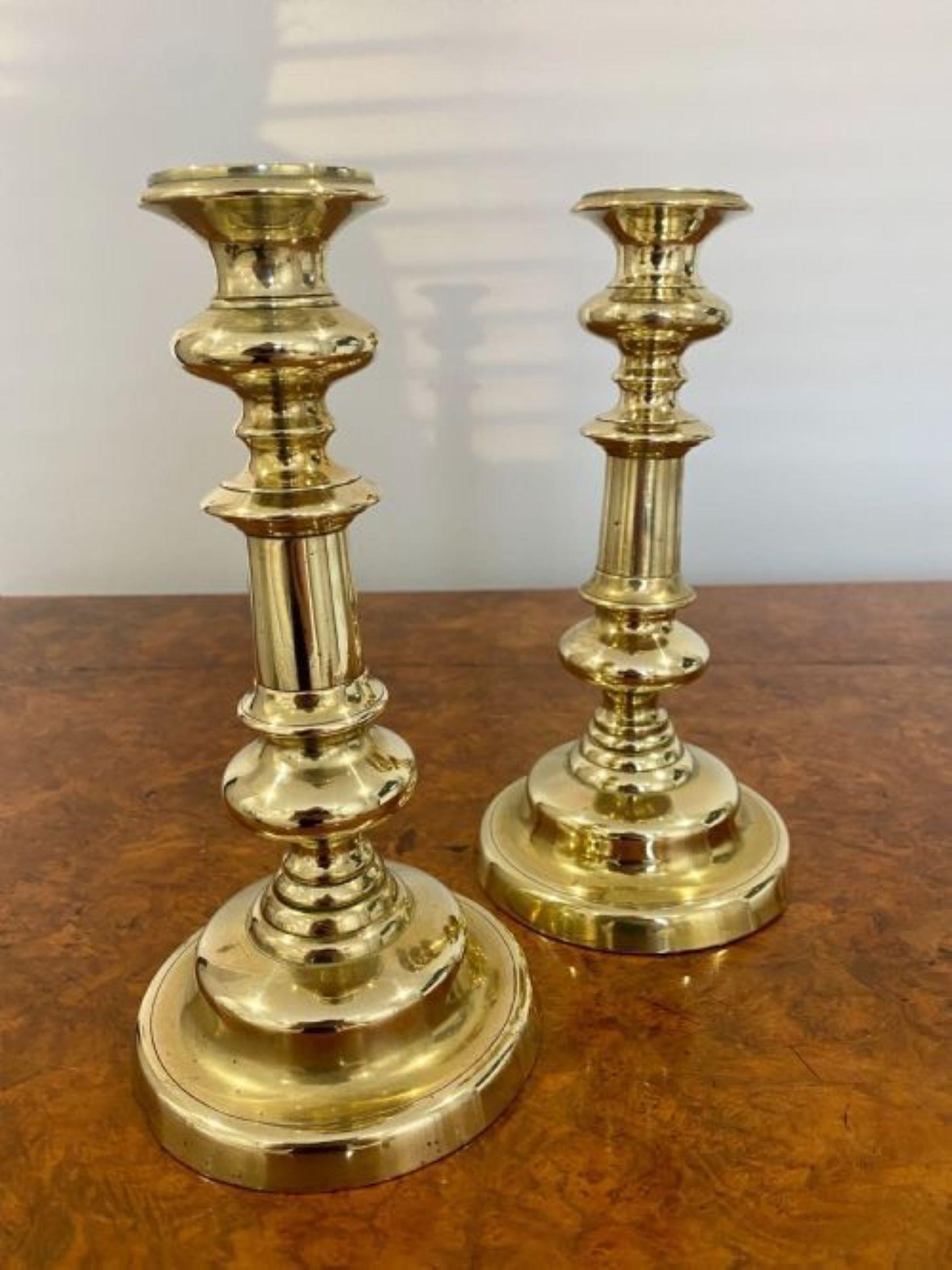 Pair of George III quality brass candlesticks having a quality turned column raised on a circular base 
