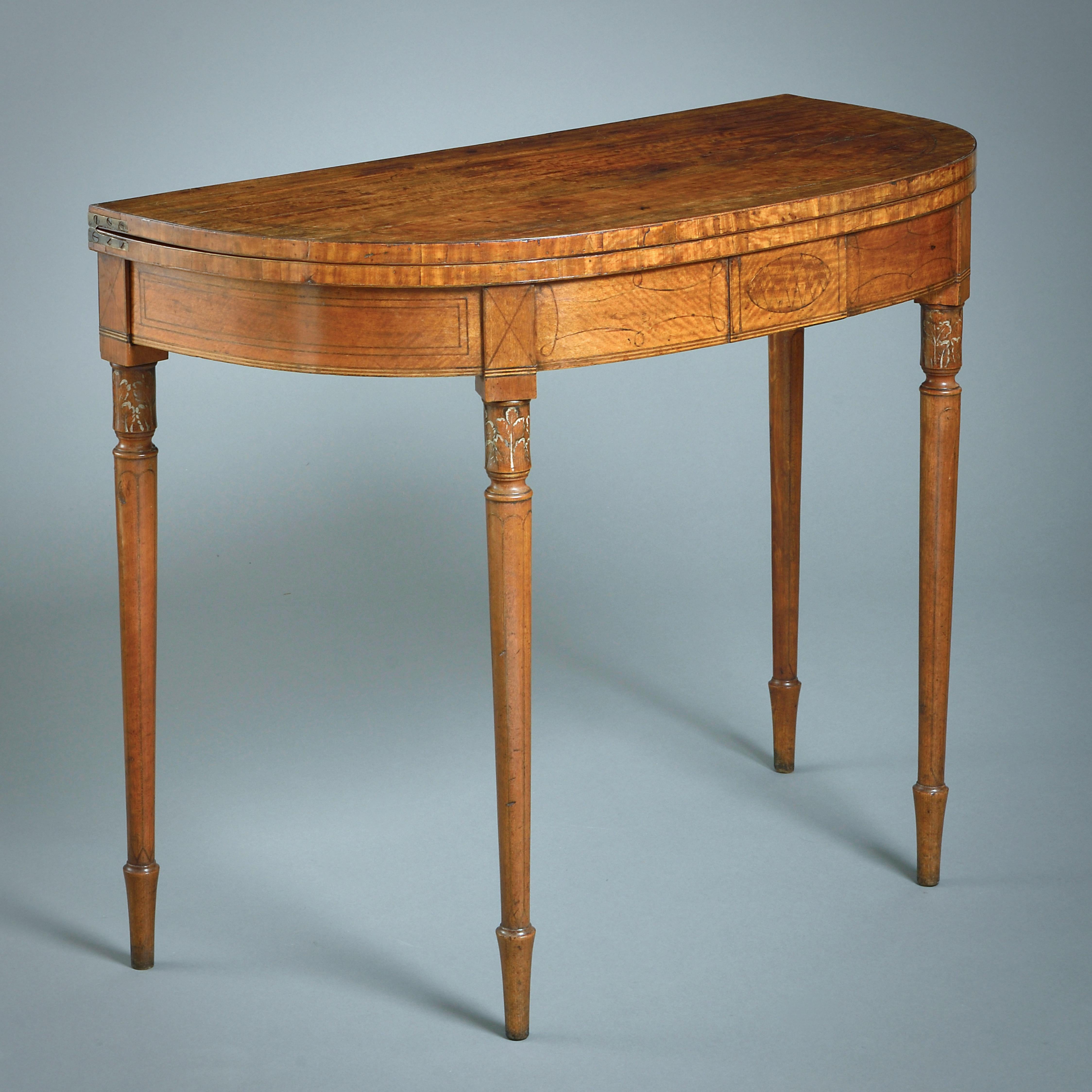 A FINE PAIR OF GEORGE III SATINWOOD CARD-TABLES, CIRCA 1790.

Each with a line-inlaid frieze, the turned legs with painted foliate capitals.