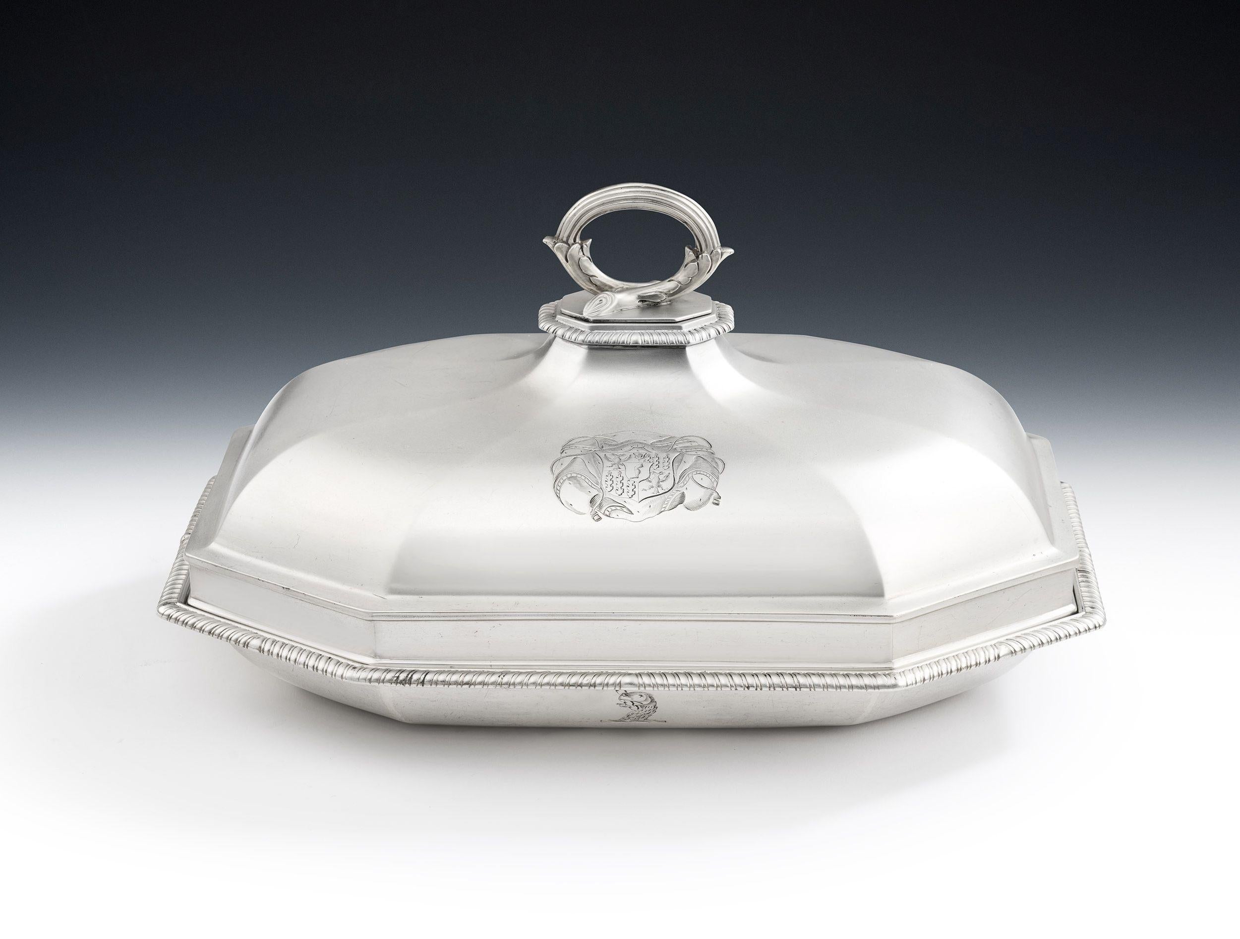 The Harwarden Castle Dishes. An exceptionally fine pair of George III Serving/Vegetable Dishes and Covers made in London in 1801 by Robert Sharp.

The Dishes are of an elegant elongated octagonal form.  The bases rise to a stepped rim decorated with