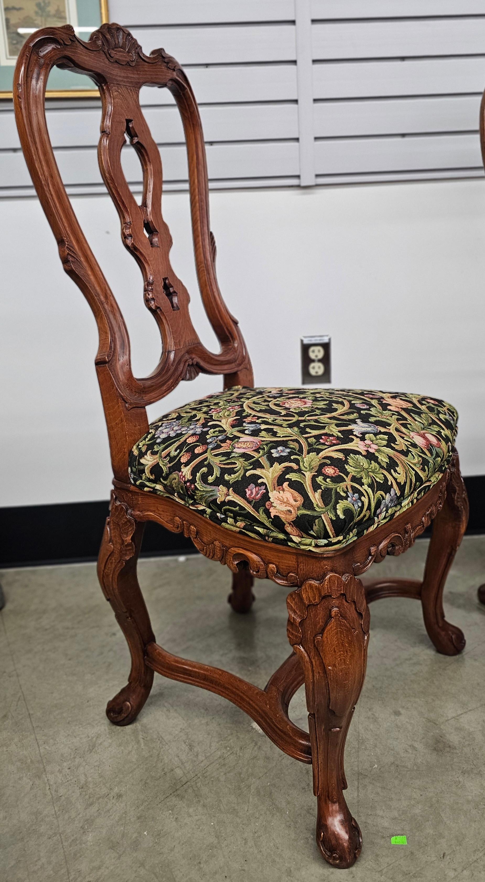 Stained Pair of George III Style Carved Fruitwood and Floral Upholstered Side Chairs For Sale