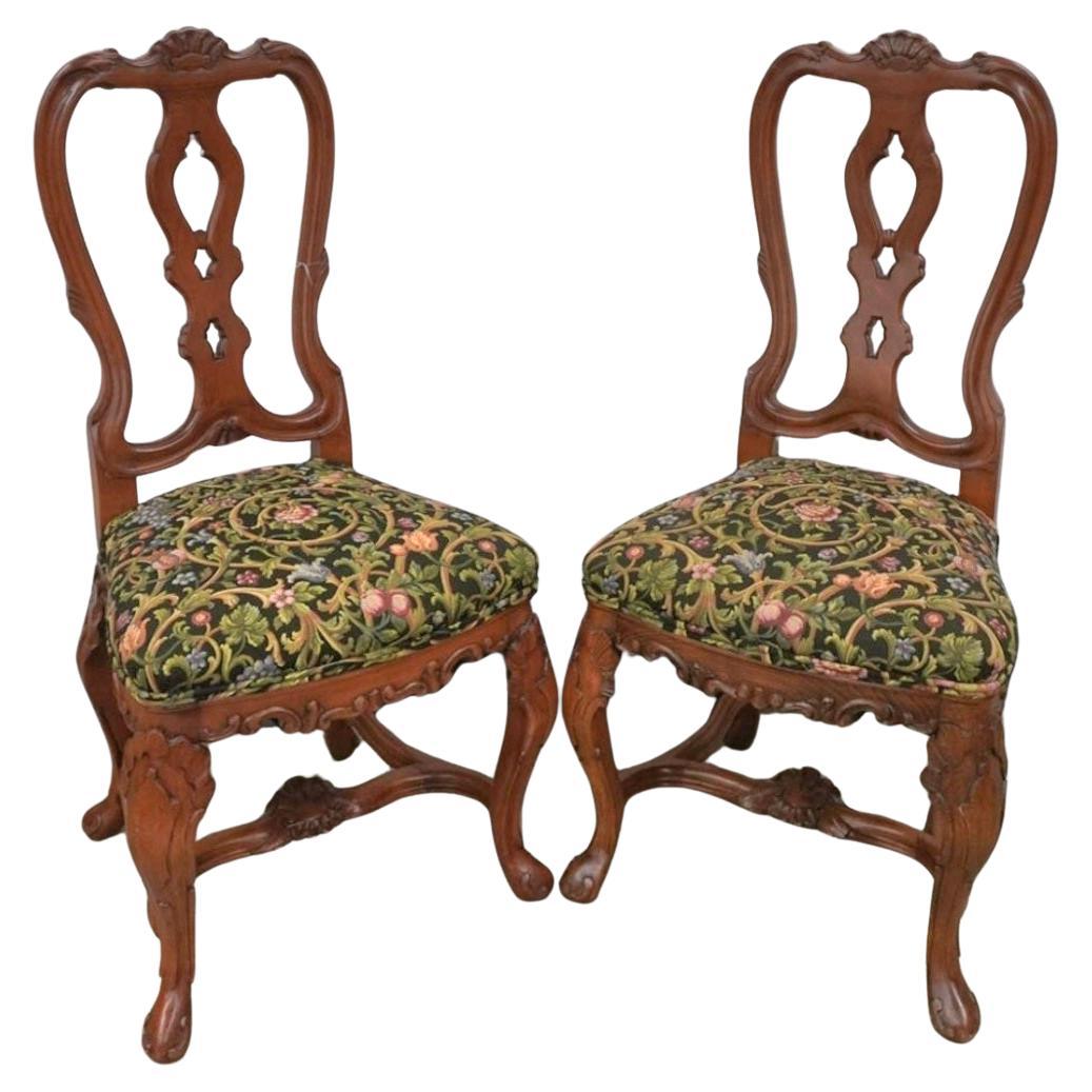 A Pair of George III Style Carved Fruitwood and Floral Upholstered Side Chairs. Intricate carvings. Great vintage condition.
Measures 20