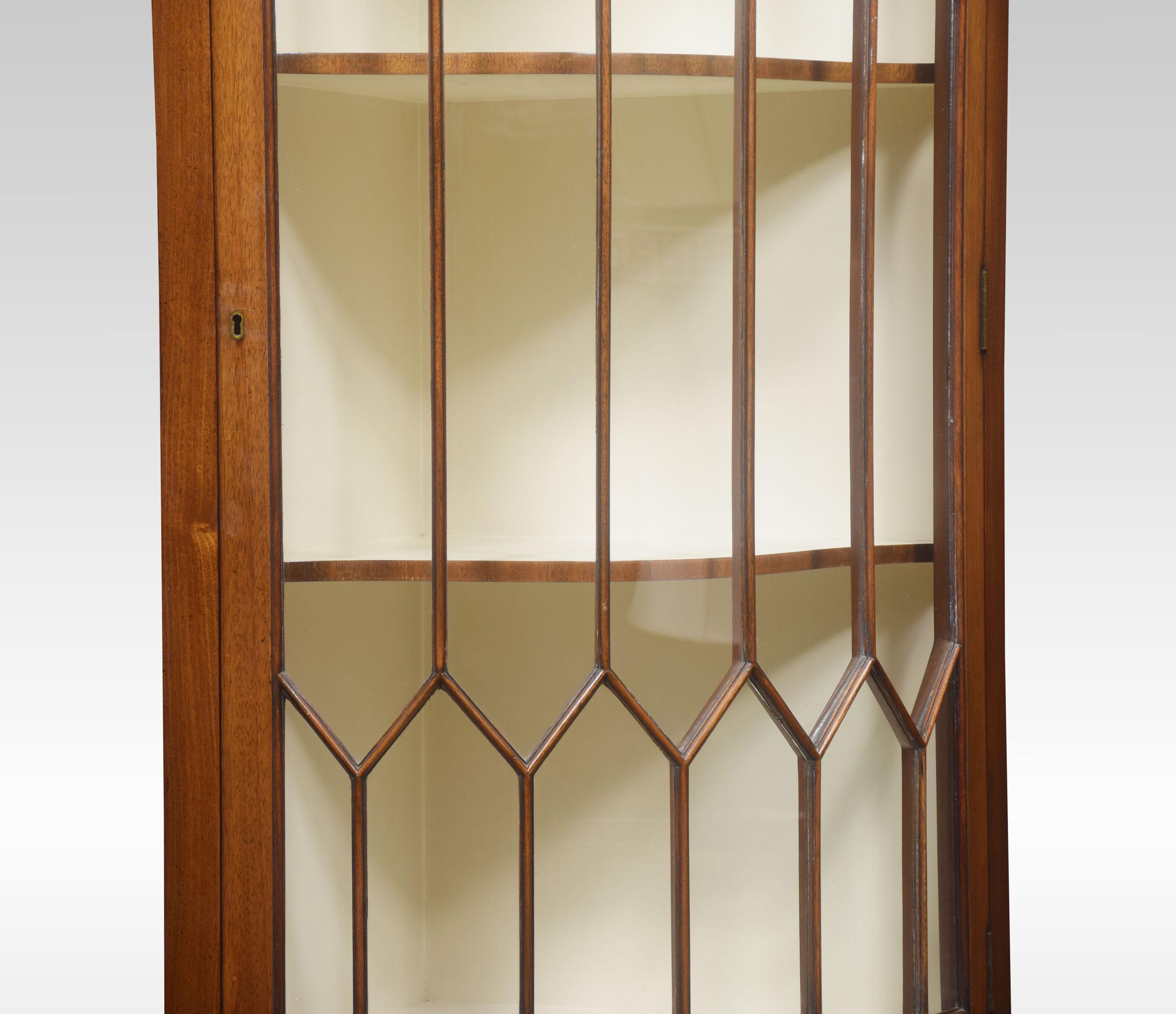 A Pair of mahogany standing corner cupboards, the bow-fronted astragal glazed doors opening to reveal to fixed shelves above a bow fronded flame mahogany panelled door, raised up on shaped bracket feet.
Dimensions
Height 75 inches
Width 26