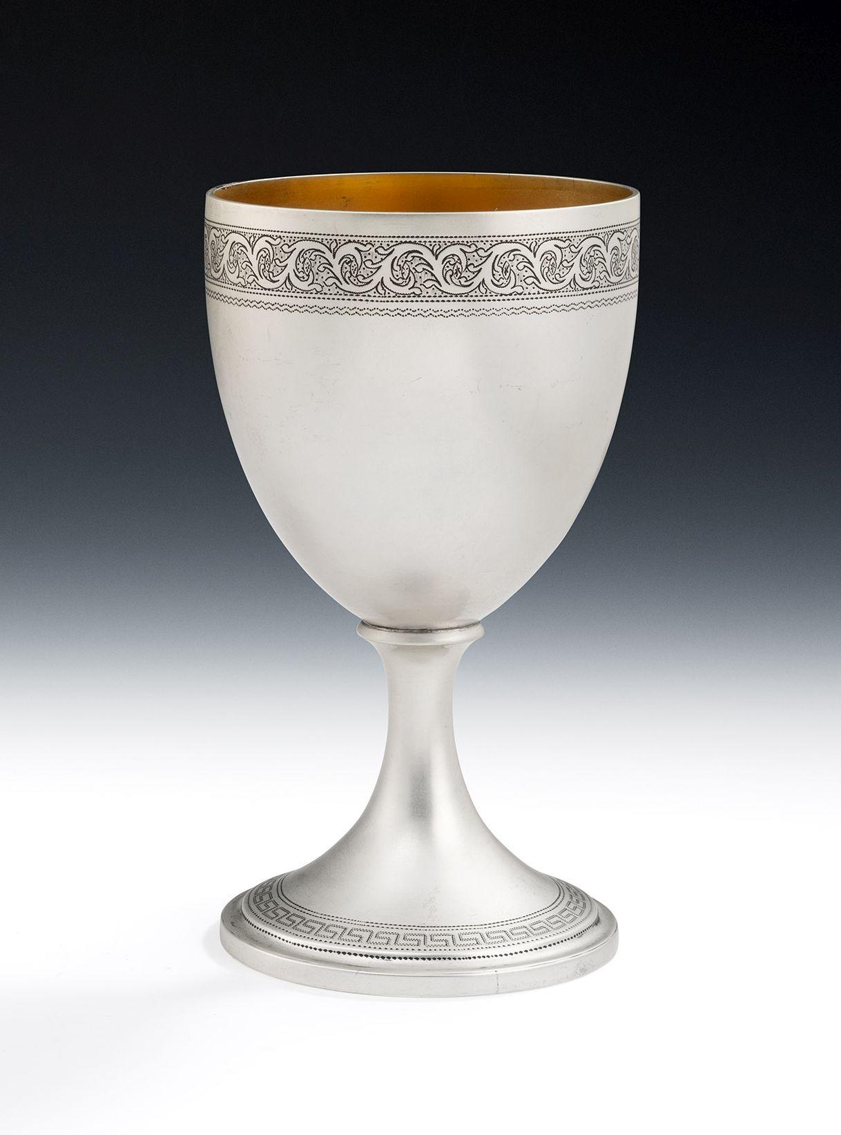 A very fine pair of George III Wine Goblets made in Edinburgh in 1806 by James Douglas.

The Goblets stand on a circular pedestal foot decorated with a Greek key and prick dot band.  The vase shaped main body is decorated at the rim with a band of