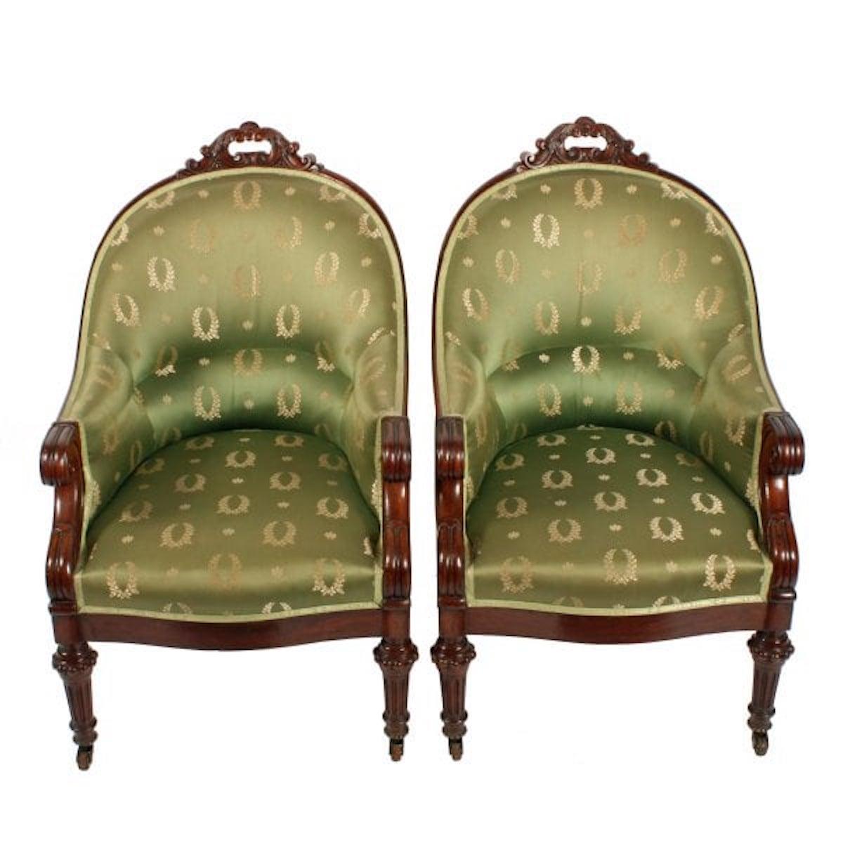Pair of George IV Library arm chairs

A pair of early 19th century George IV mahogany library arm chairs.

The chairs have a high curved back with a carved scroll decoration to the top.

The chairs have tapering fluted front legs with casters