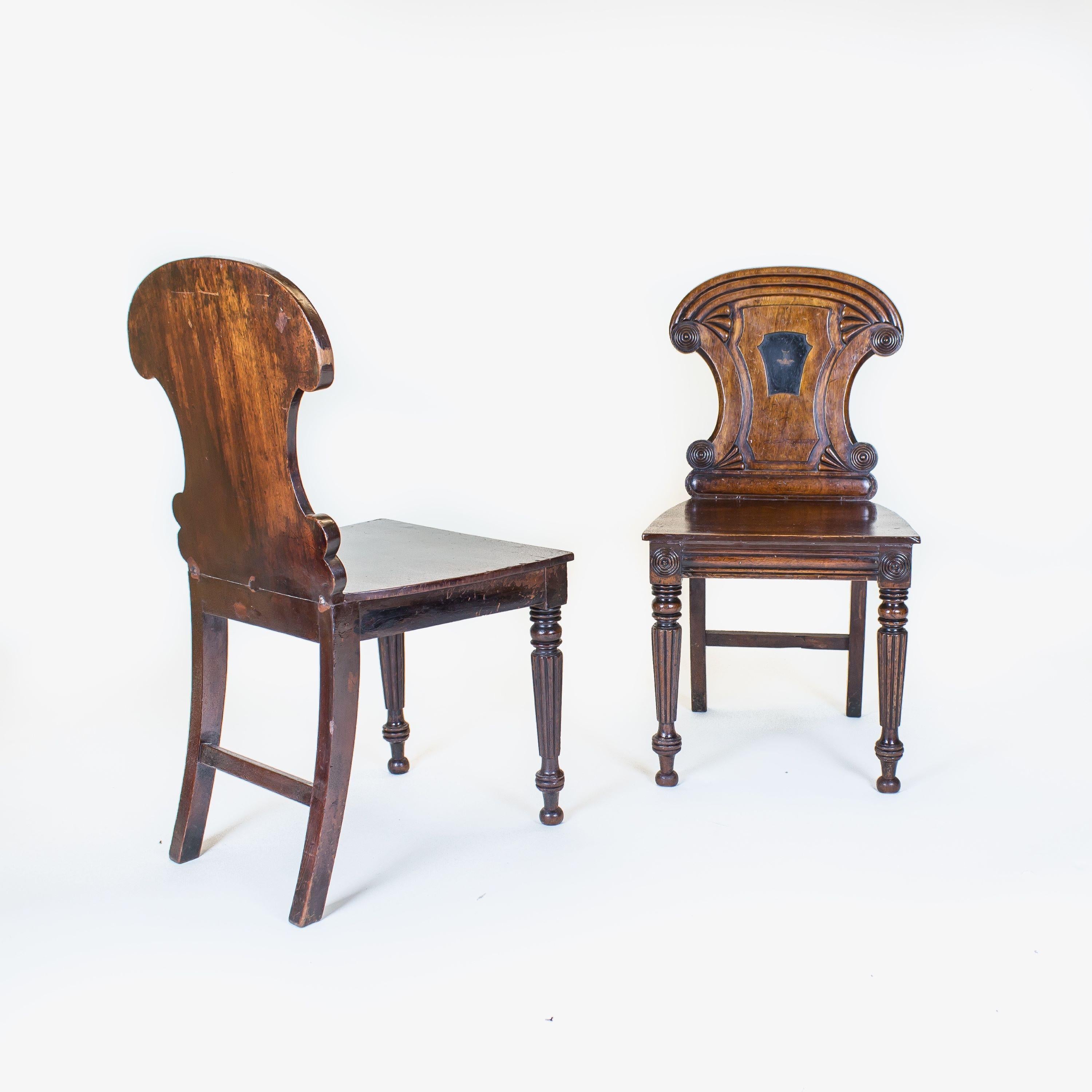 The waisted backs with turned roundels and a central ebonised reserve. Probably by Gillows.

England, circa 1825