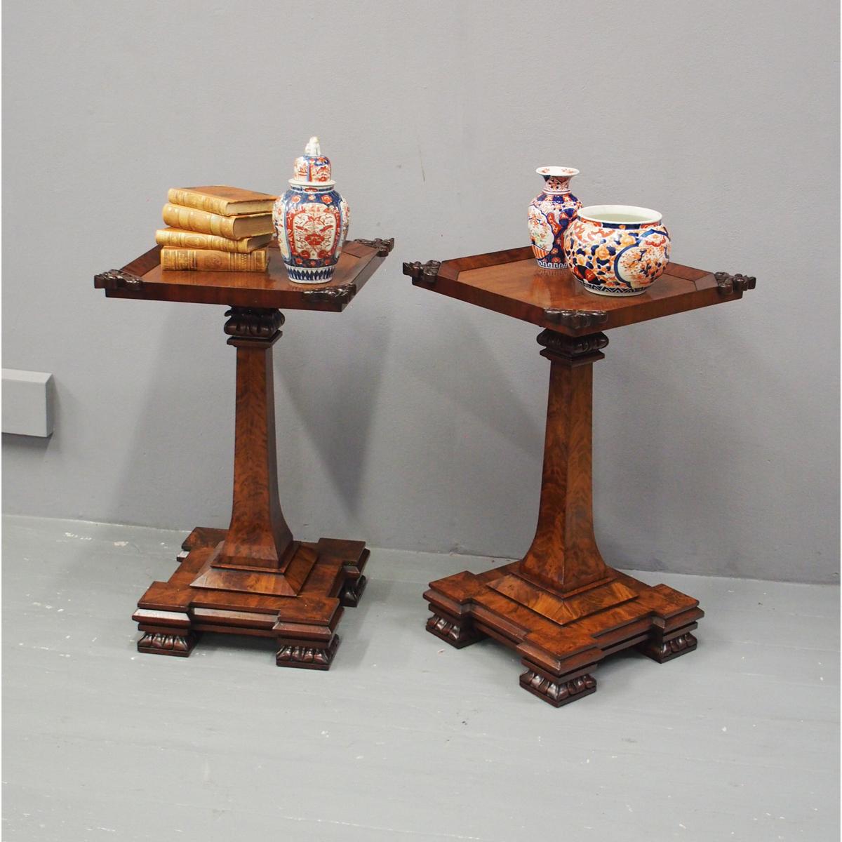 Rare pair of George IV flame mahogany occasional tables, with adaptations, circa 1825. With foliate carving to each corner of the top and a flat fore-edge, with a capital and carved flowers beneath it. There is a well figured mahogany block which