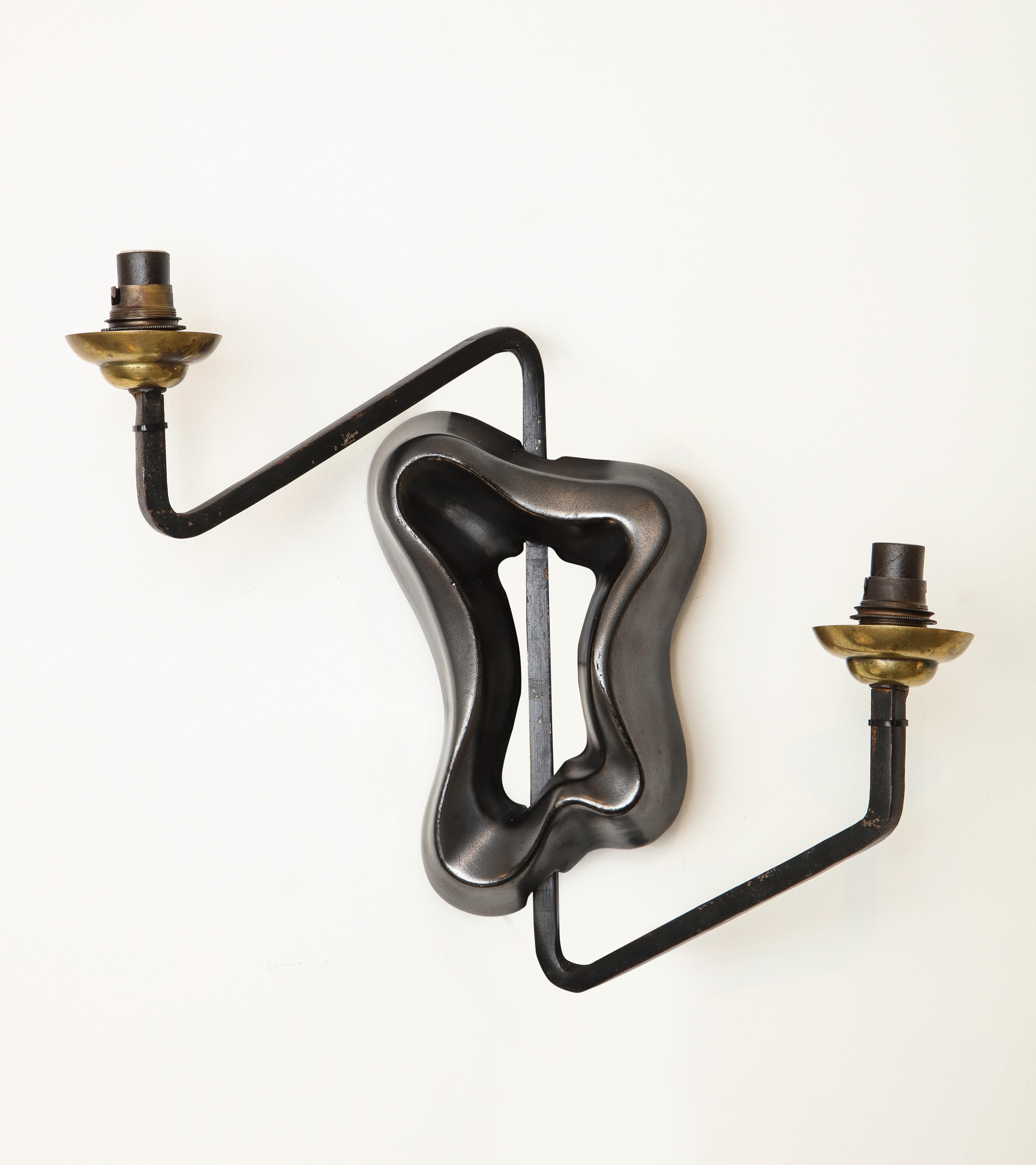 George Jouve sconces, Edition Marcel Asselbur, circa 1950s (not later editions)
Ceramic, Iron, Brass
Measures: H 13, W 13.75, D: 4.75 in.

rewired.