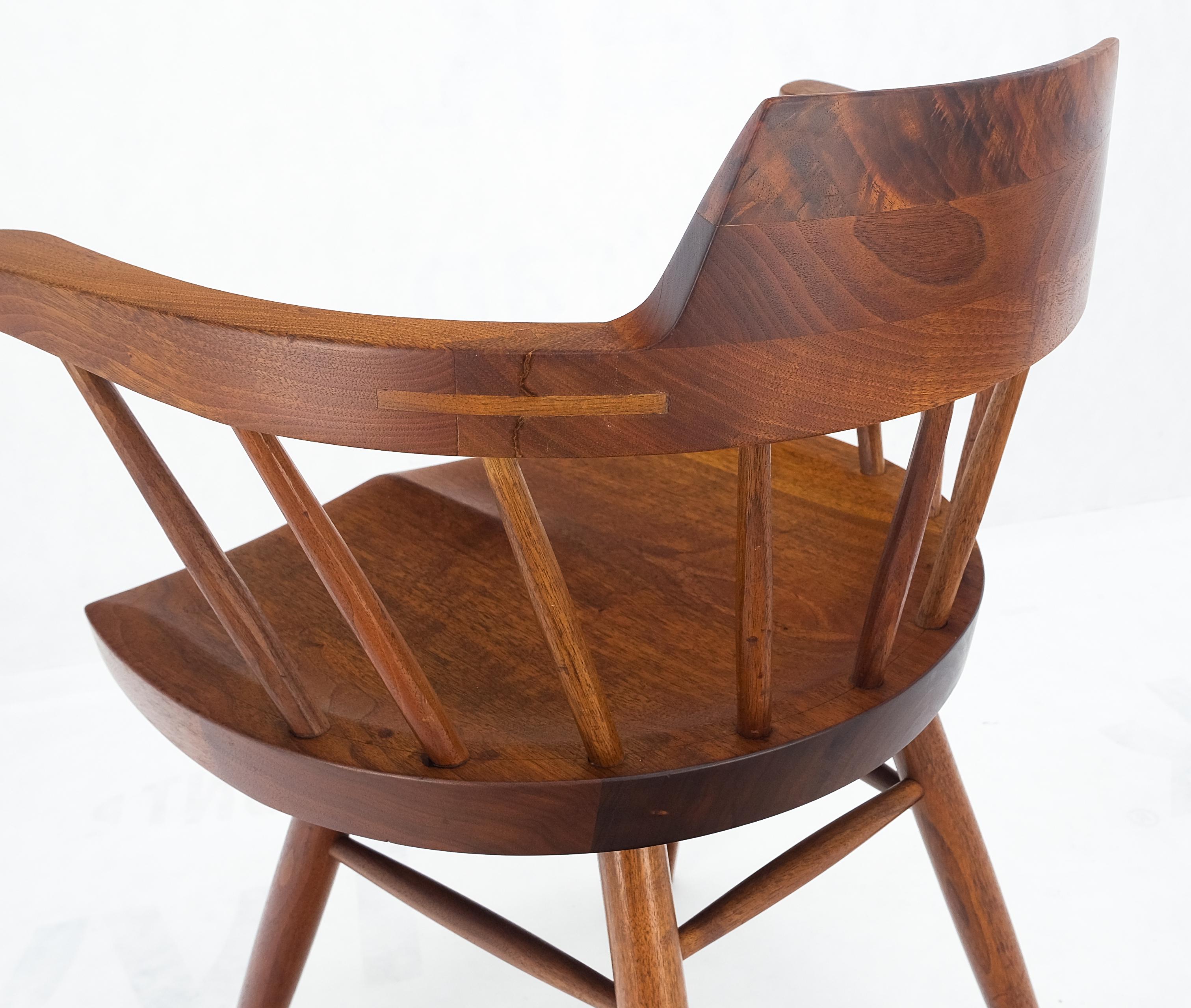 Pair of George Nakashima Captain's Dining Chairs in Walnut.

