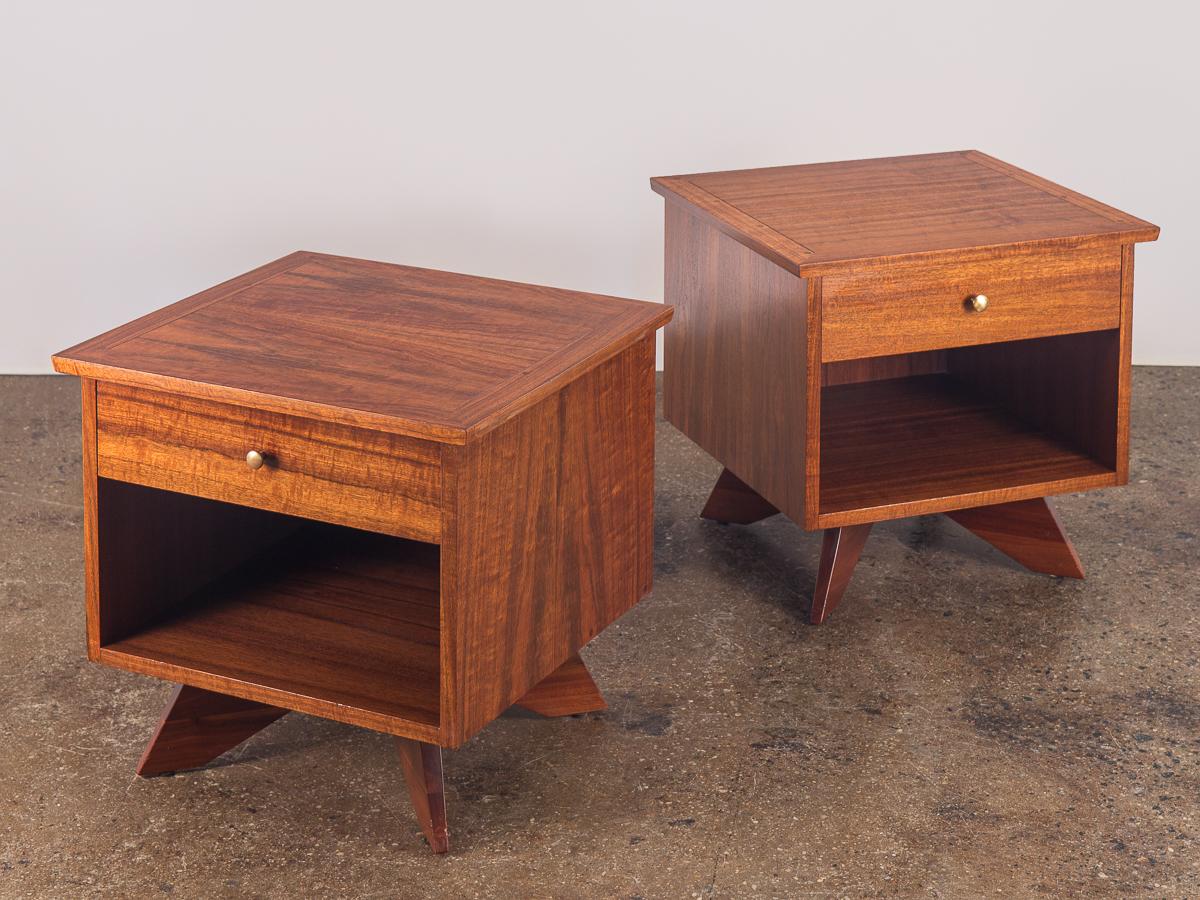 A pair of highly sought after nightstands designed by George Nakashima. The wood is dramatic and gleaming, both are very attractive from all angles. Condition is excellent. The top and sides are stunning. Solid walnut base supports and elevates the