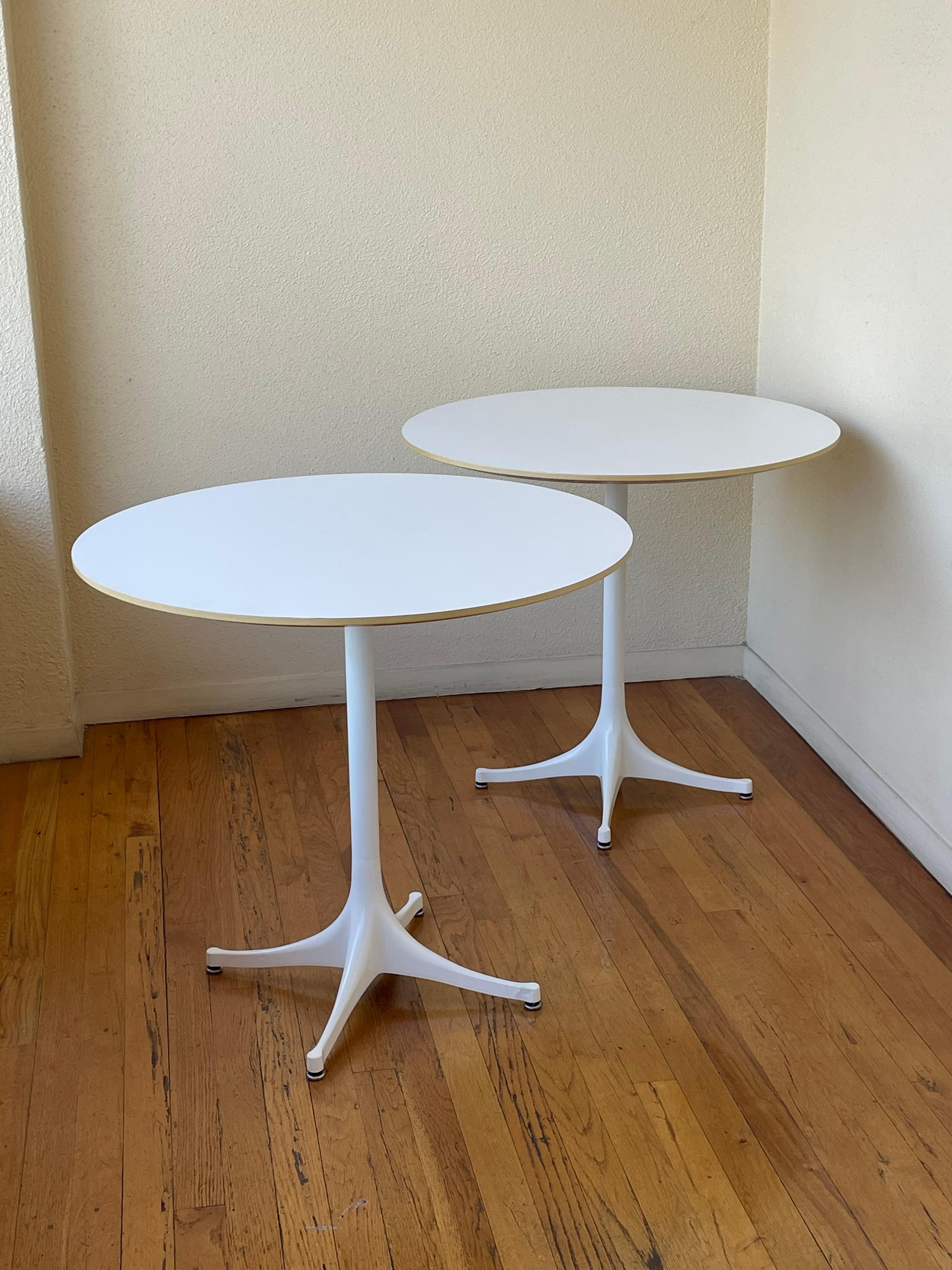 Nice pair of pedestal tables designed by George Nelson for Herman Miller, great condition model 5254 white laminate top over the white metal pedestal. And beveled edge. Priced separately buyer has the choice to buy 1 or 2.