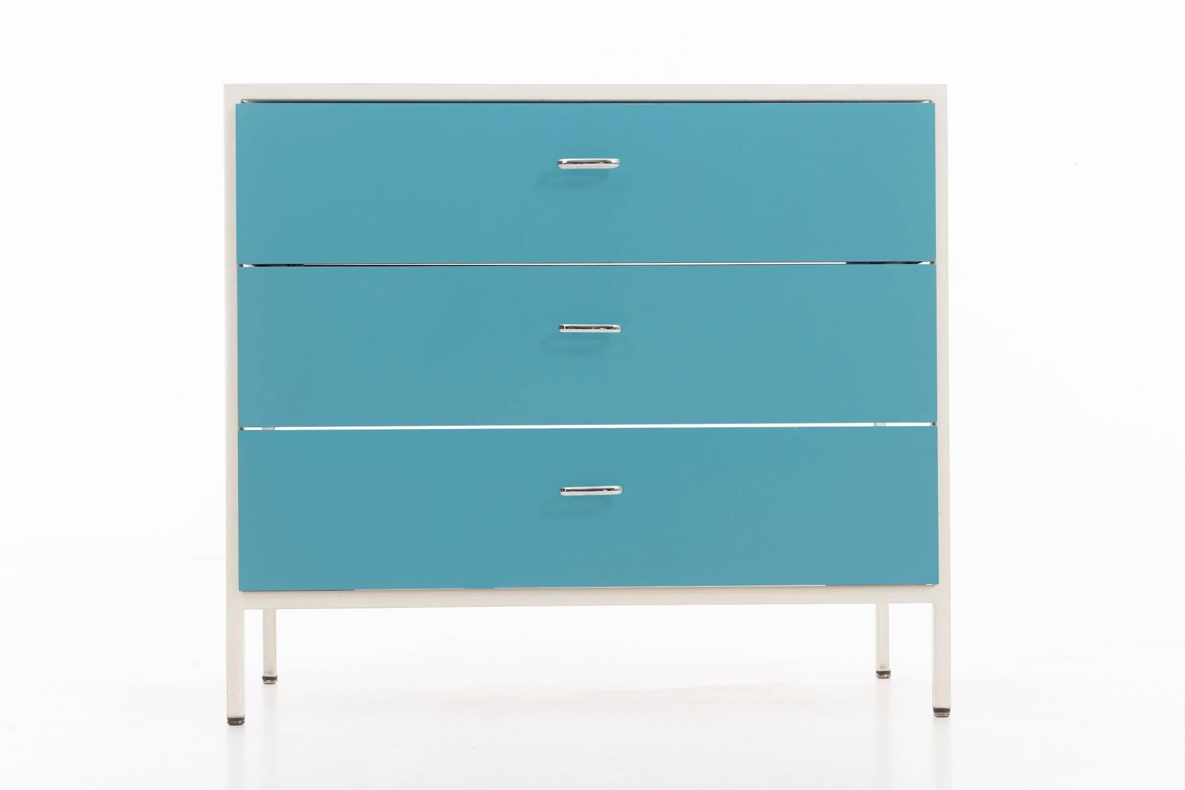 Nelson steel frame cases, solid oval rings as pulls with wooden drawers tongue and grove joinery, painted blue fronts, original white steel frames.