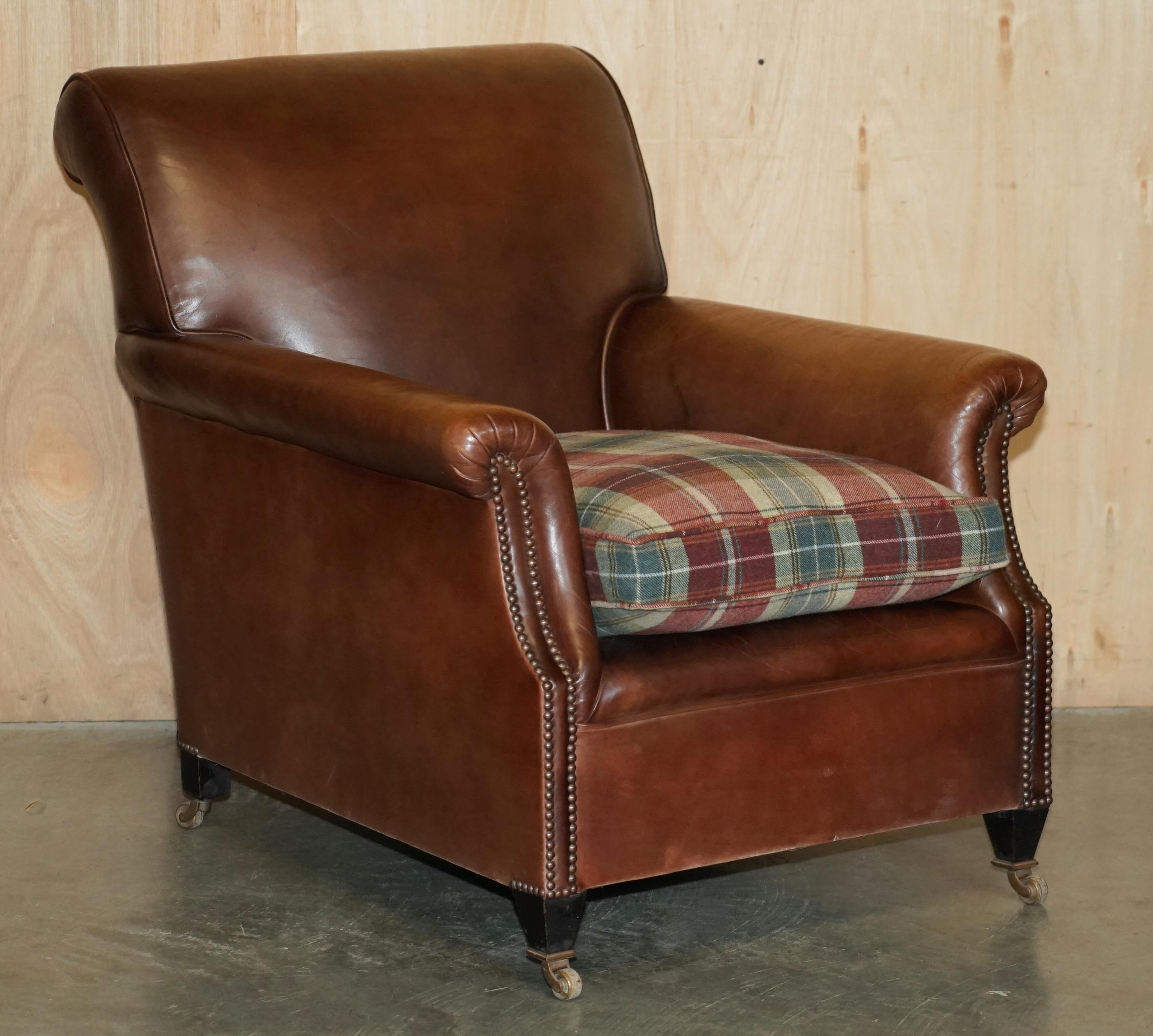 Royal House Antiques

Royal House Antiques is delighted to offer for sale this stunning original pair of George Smith Signature Scroll arm armchairs in brown leather with Scottish Tartan wool upholstered overstuff feather filled cushions which are