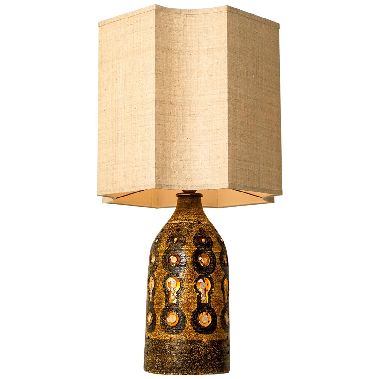 Georges Pelletier table lamps, circa 1970, France. Glazed ceramic with decorative designs
With wonderful off white and taupe (silk) shade from Rene Houben. 

In very good original condition. Cleaned well wired and ready to use. Each light