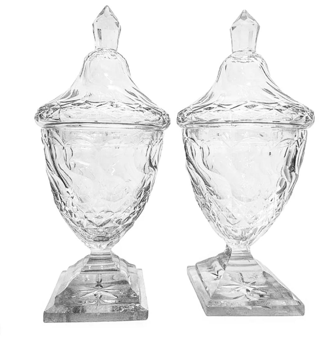Beautiful matched pair of handwheel cut crystal or blown leaded glass Georgian sweet meat covered urns. 
Likely made in Bristol in the 18th century, with optic like exteriors that are deeply cut deeply cyt gadroons and diamond mounted on a