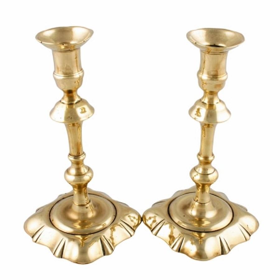 A pair of 18th century George II brass candlesticks.

The candlesticks have been made in three parts with a seam down the centre of the stick.

The candlesticks are in good condition, the underside has solder in the centre to prevent them from