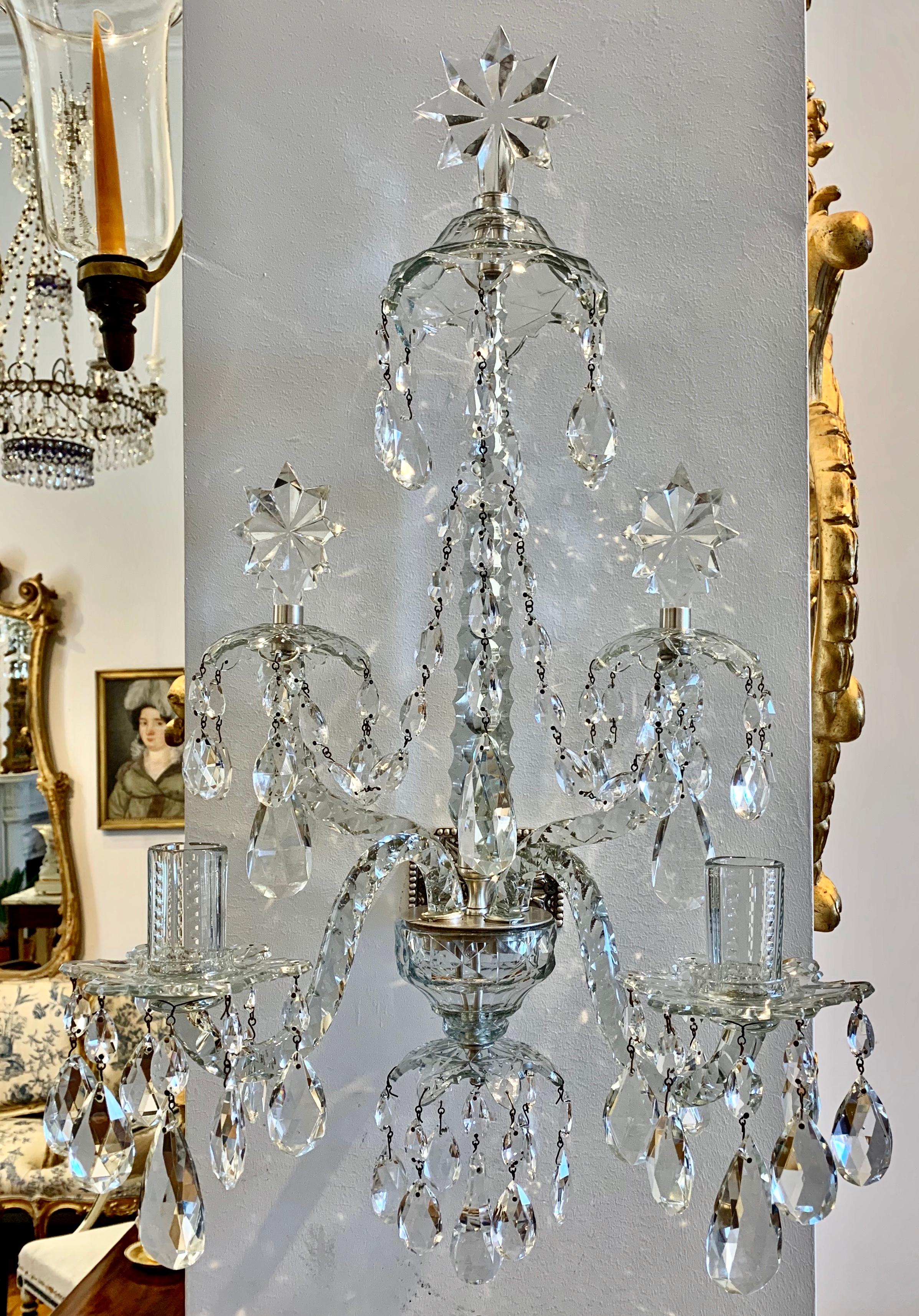 Pair of Georgian neoclassical style crystal sconces. In light 