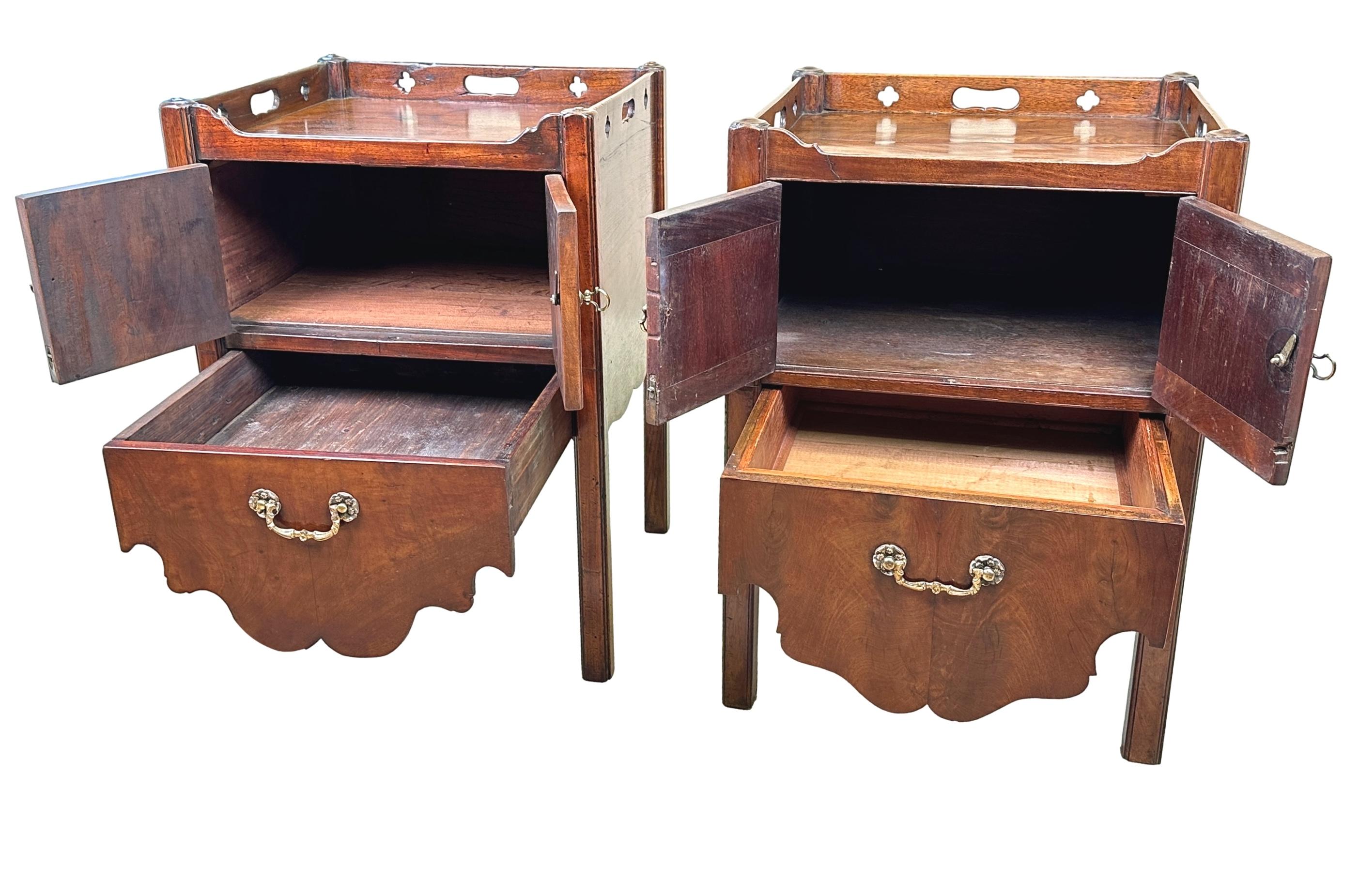 An Extremely Well Matched Pair of 18th Century Mahogany Bedside Night Tables, Or Tray Top Commodes, Having Pierced Decoration To Galleried Tops Over Well Figured Pairs Of Cupboard Doors And Converted Pull Out Drawers, Raised On Square Chamfered