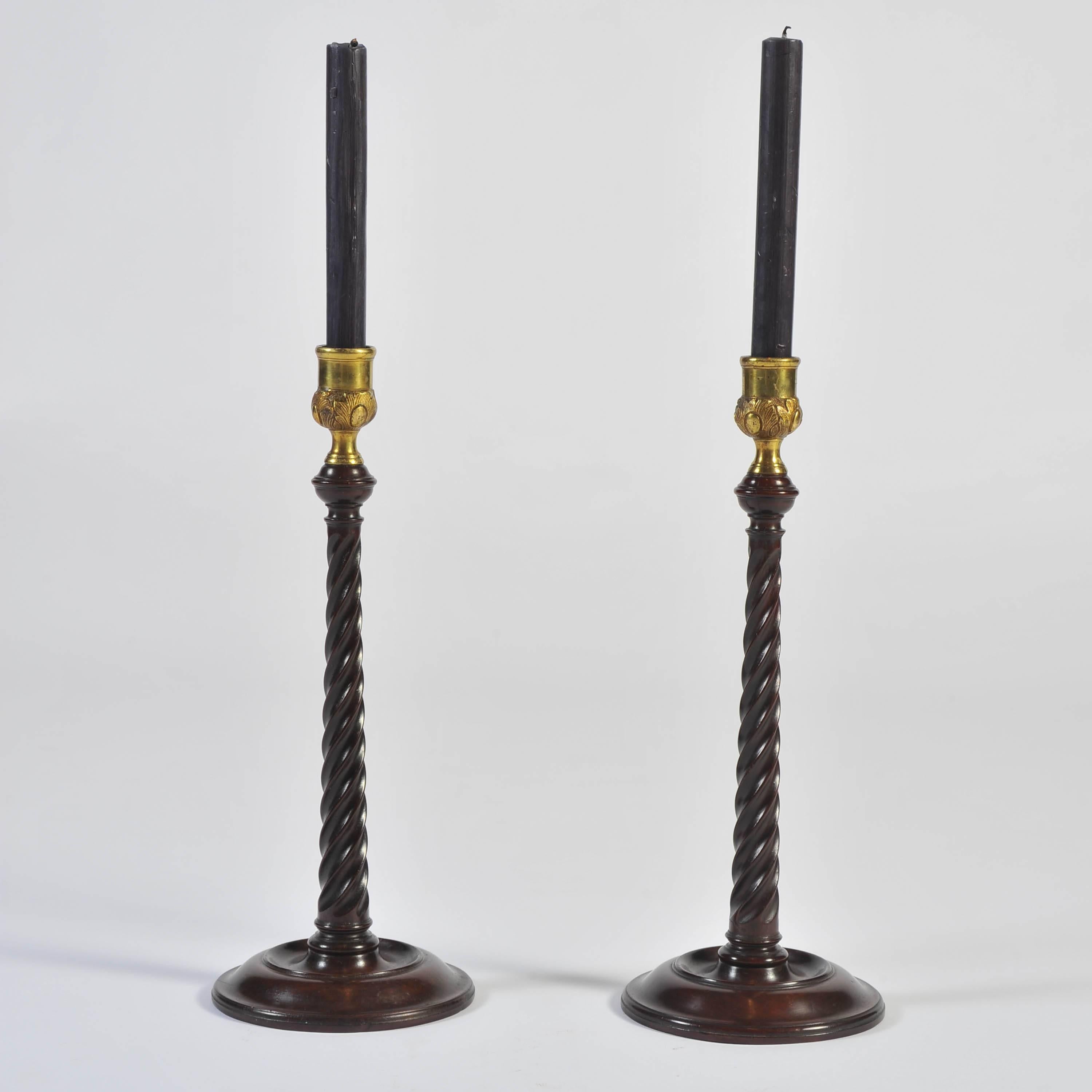 These wonderful candlesticks with moulded bases, spiral twist stems and brass sconces.
Good scale, superb rich color and in fabulous condition.
The bases lead filled as they should be.