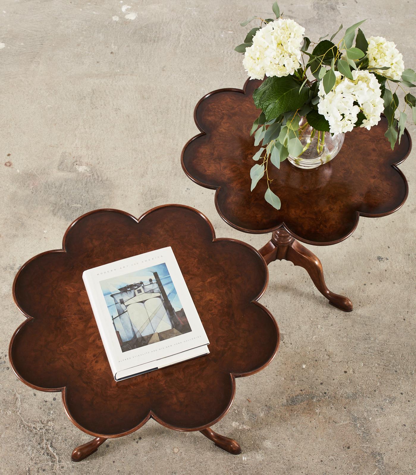 Fine pair of matching Georgian mahogany tilt-top dessert or tea tables featuring clover shaped tops. The shaped tops are inlaid with a rich burl veneer having a wonderful flame pattern and movement. The tops are supported by a tilt bird cage