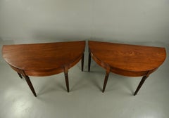 pair of Georgian mahogany demi lune console tables