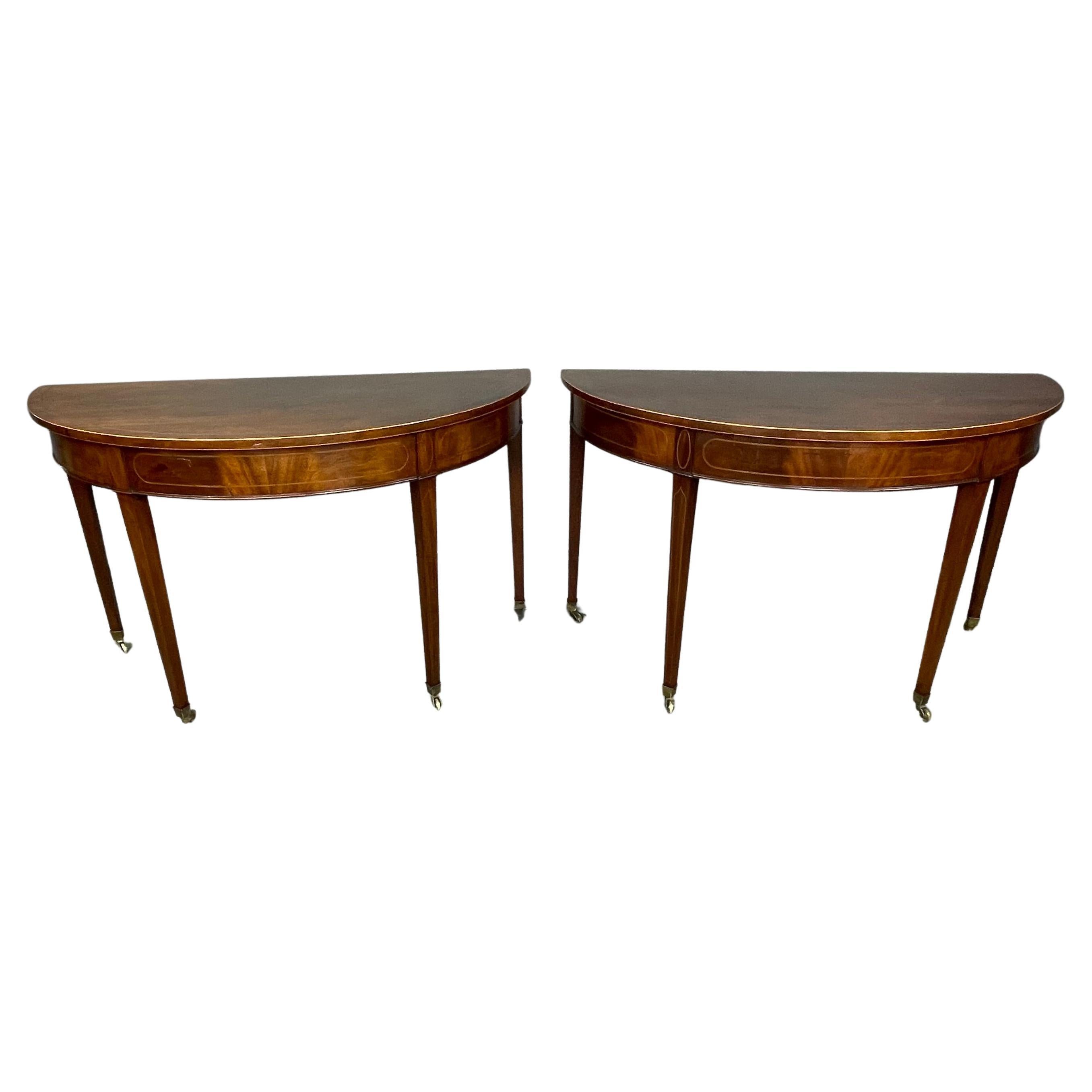Pair of Georgian mahogany demi lune console tables 