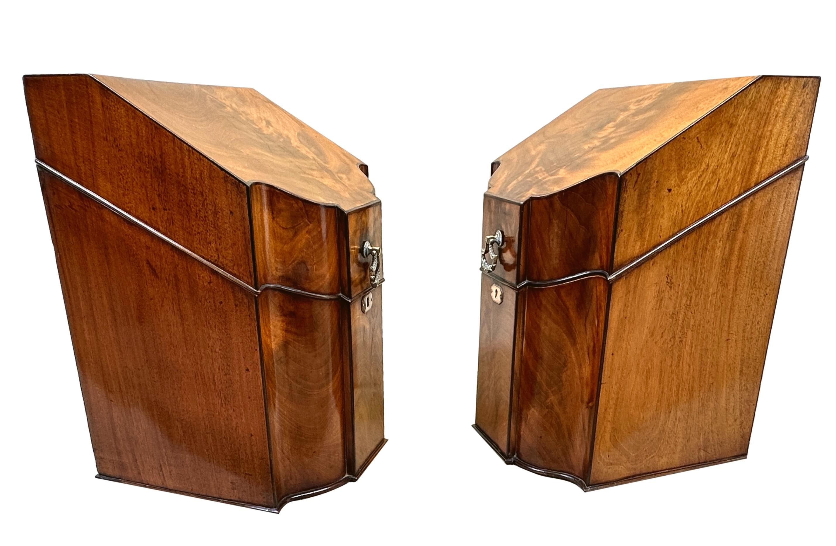 A Delightful Pair Of 18th Century, Hepplewhite Period, Georgian Mahogany Pair Of Knife Boxes, Or Cutlery Boxes, Having Elegant Serpentine Fronts, Superbly Figured Lift Up Lids, Enclosing Fitted Cutlery Decks With Apertures Of Various Shapes And