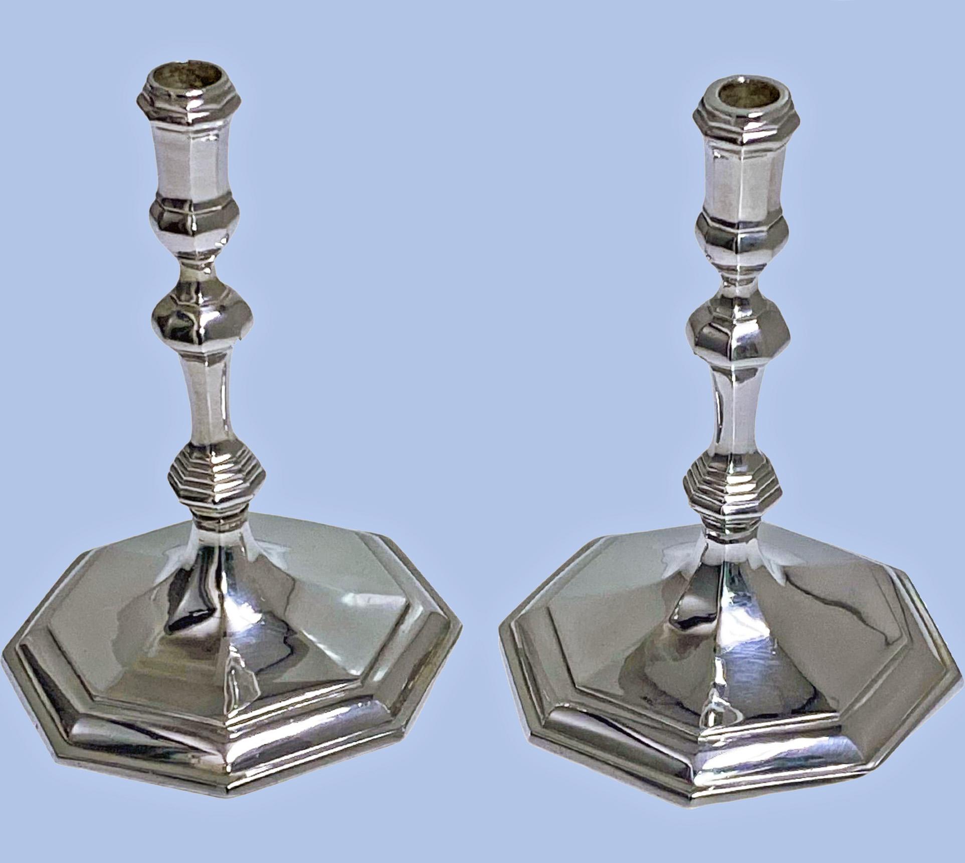 Pair of matched George I style sterling silver taper candlesticks / tapersticks, London 1962-7 Wakely and Wheeler. Each on octagonal stepped spread bases, octagonal knopped column. Total Weight - 283 grams. Approx. Height - 10.50 cm. Approx.