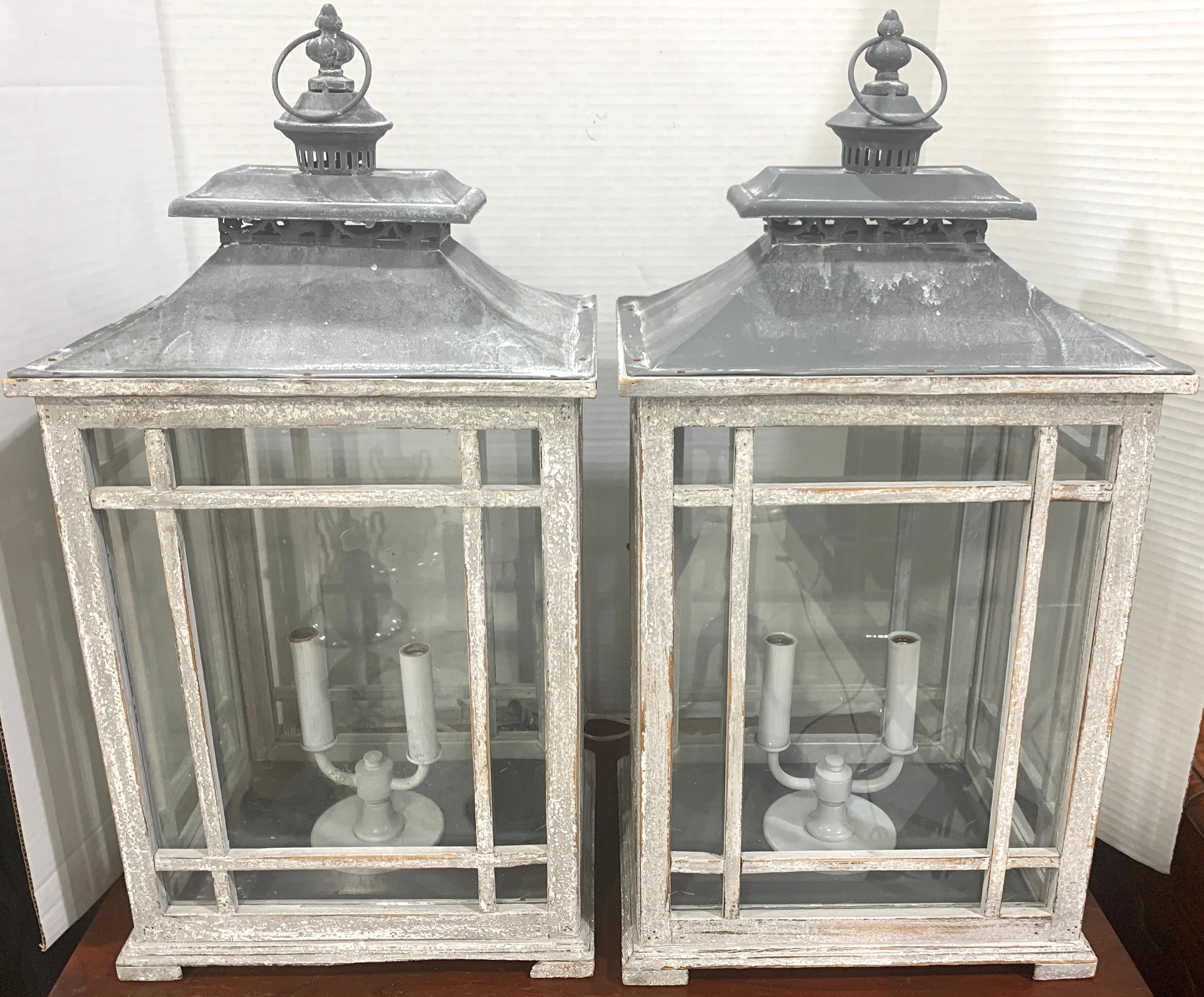 Pair of Georgian style grey painted lanterns, each one with patinated tin pagoda tops, on a rectangular case fitted with mullioned glass with one 11