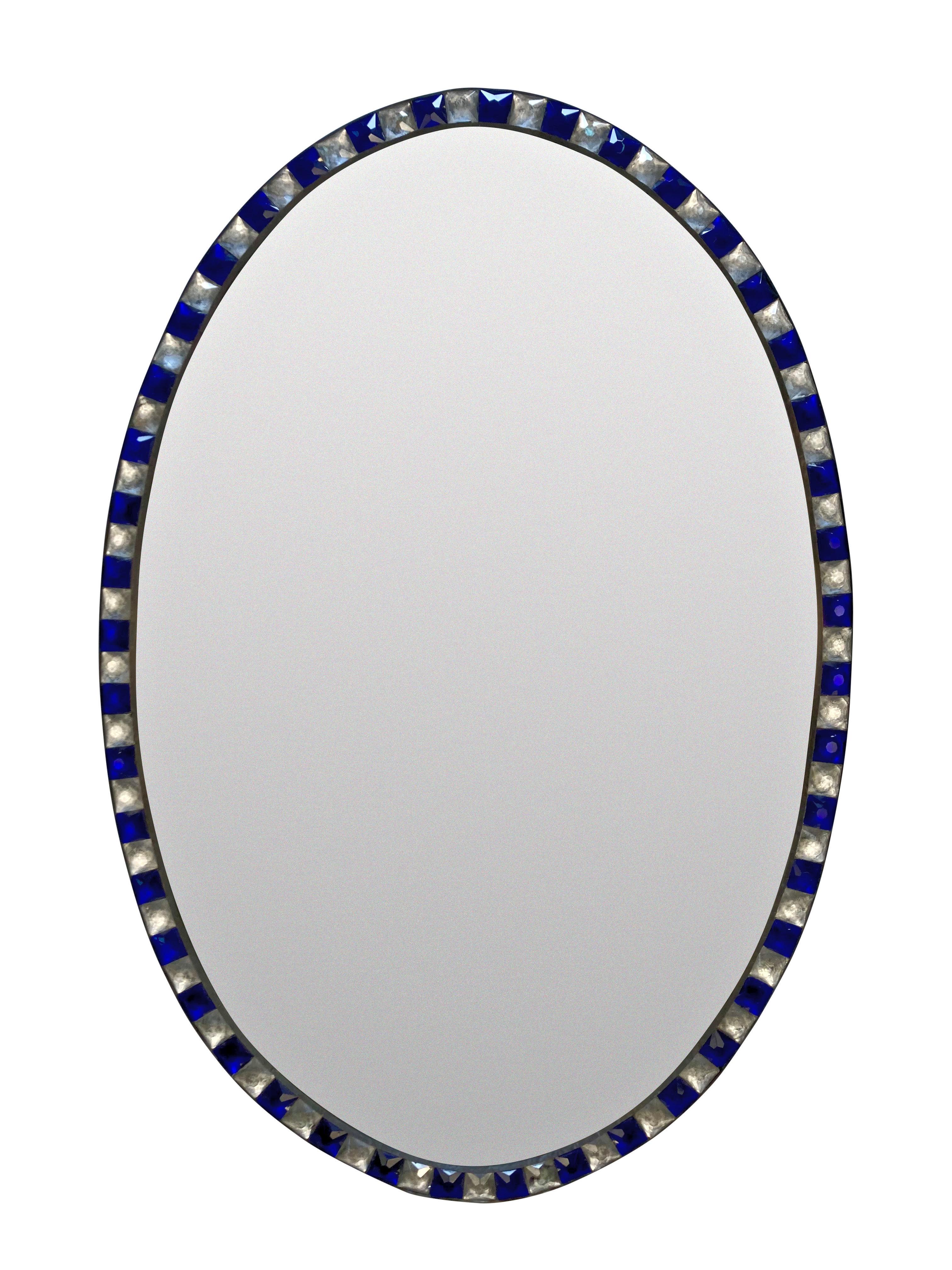 A pair of Irish mirrors in the George III style, of good quality with faux mercury glass mirror plates pinned into patinated copper frames, bordered with rock crystal and blue glass faceted studs in the traditional XVIII Century manner. Of good