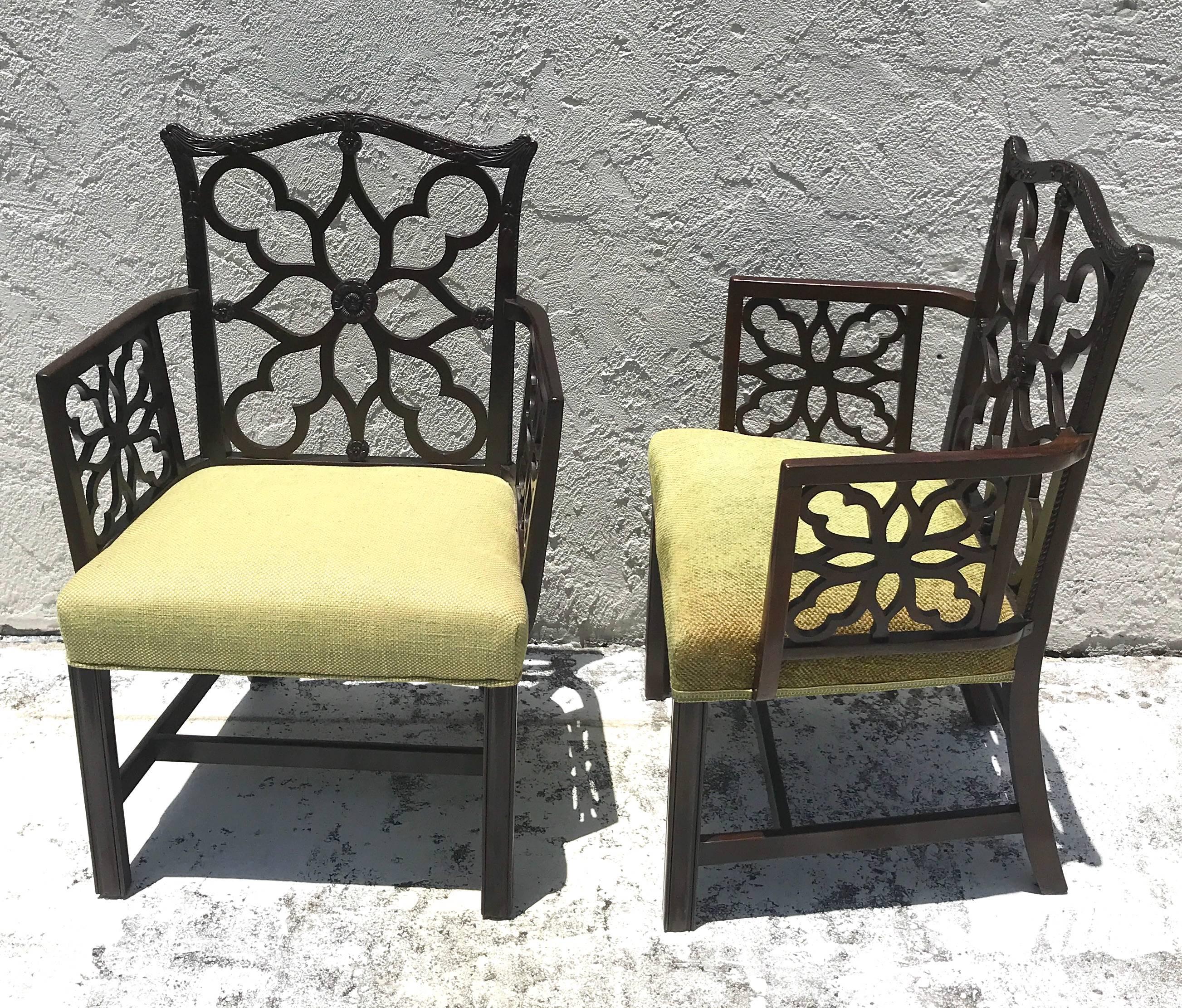 Pair of Georgian style Lattice armchairs, finely carved mahogany pierced frames,
One slightly larger, both with slightly different colored vintage upholstery.
Measures: Larger armchair is 37