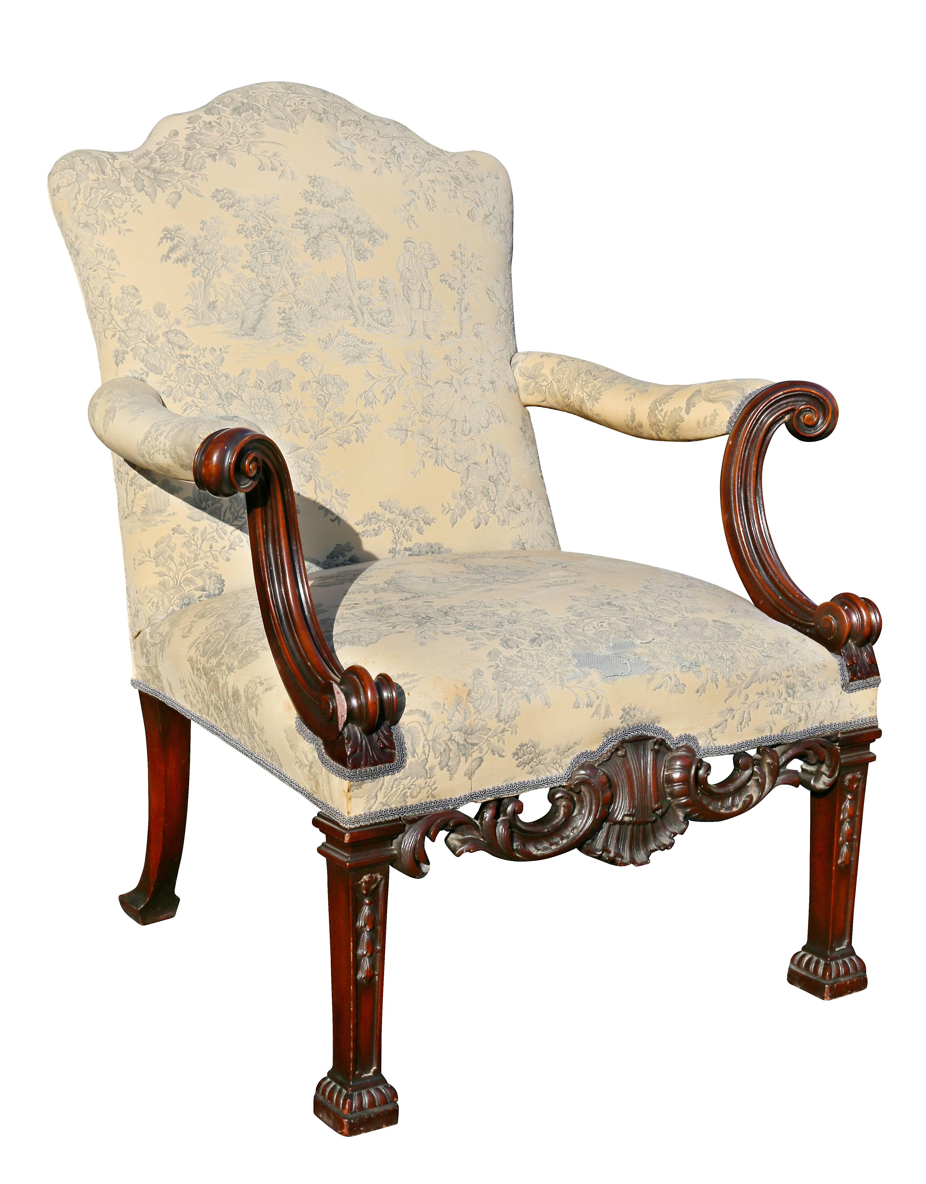 Each with serpentine backs and straight seats with scrolled arms, seat rail with mounted shell form carving, raised on carved square tapered legs with block feet.