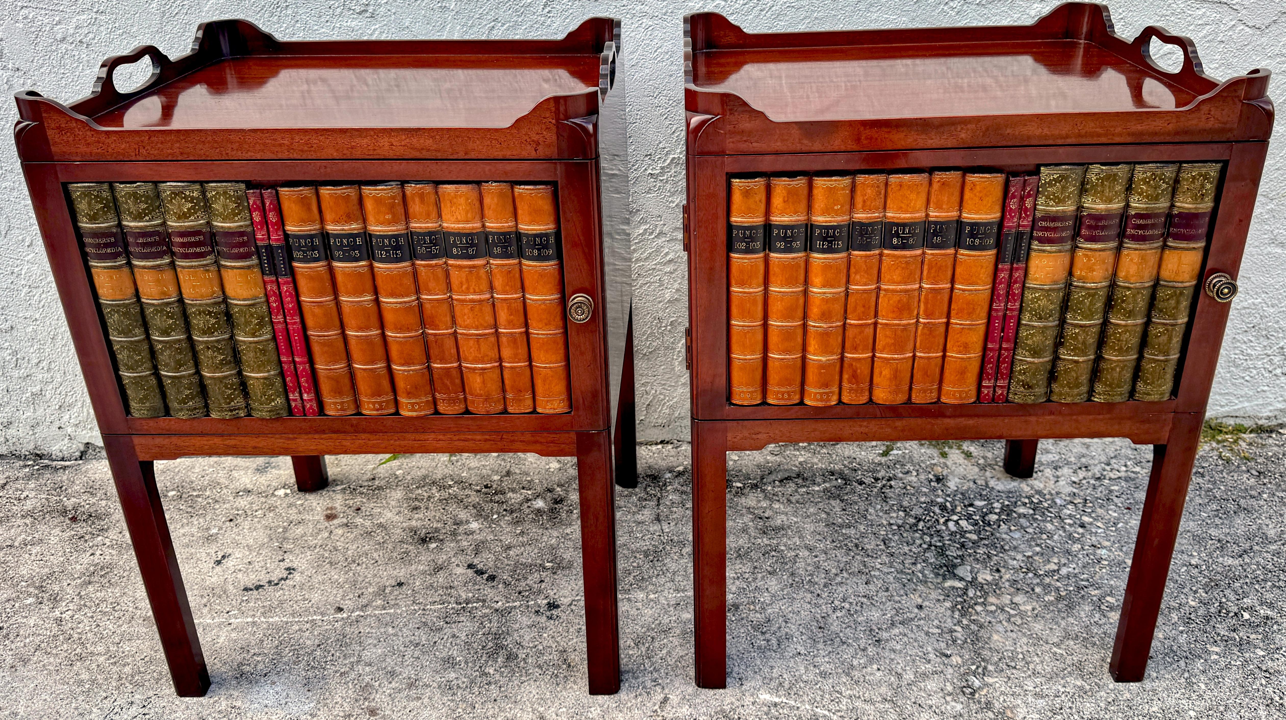 Pair of Georgian Style Mahogany and Leather Book Spine Front End Tables 
England, 20th century 

A striking pair of Georgian-style mahogany and leather book spine front end tables, crafted in England during the 20th century Each table exudes classic