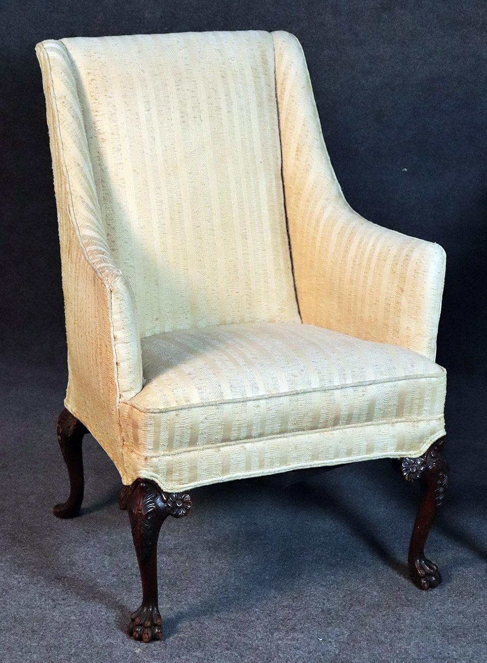Pair of Georgian style mahogany lounge chairs with claw feet.